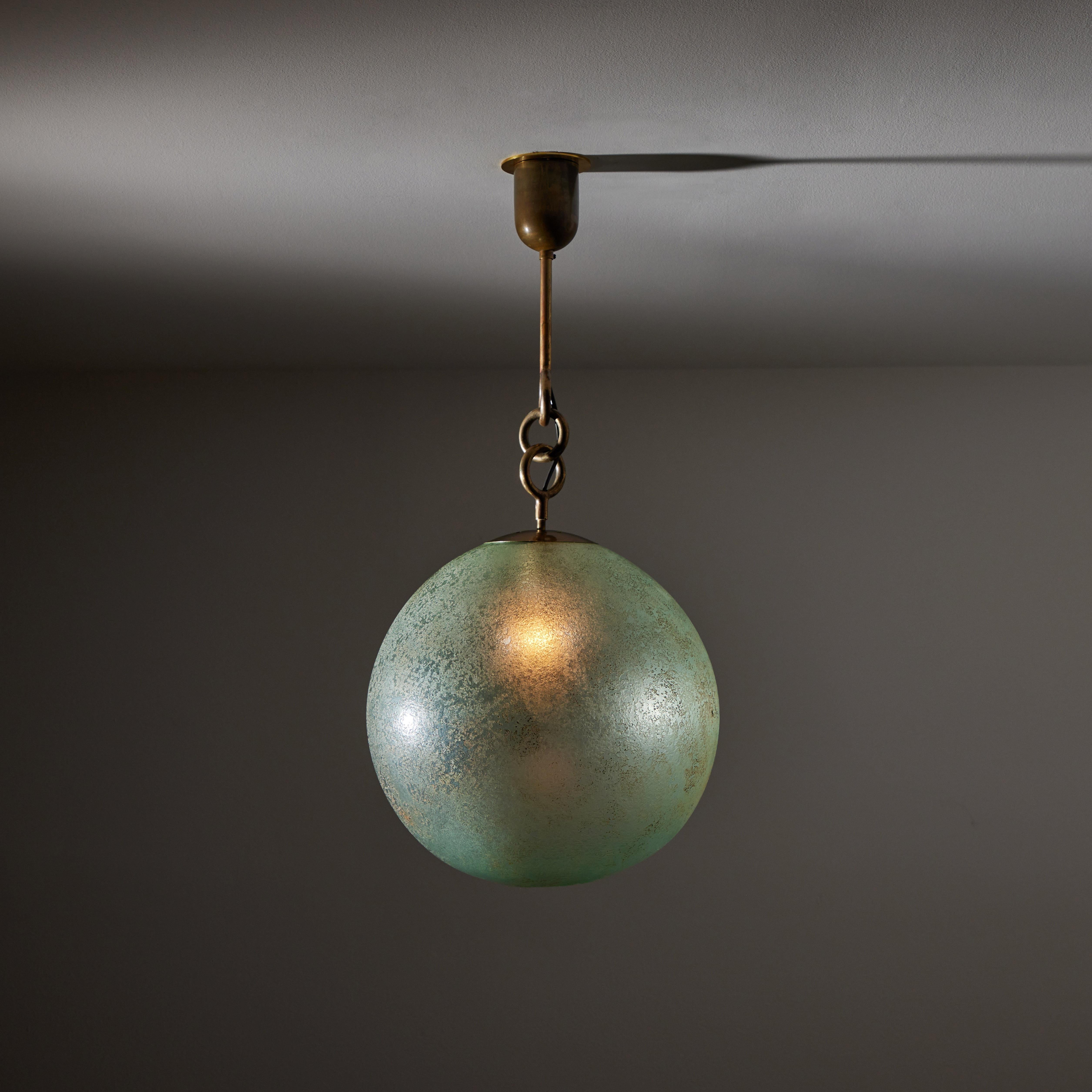 Pendant by Seguso. Designed and manufactured in Italy, circa 1940's. Hand blown Murano glass, brass. Original canopy, custom brass backplate. Wired for U.S. standards. We recommend one E27 60w maximum bulbs. Bulbs not included.