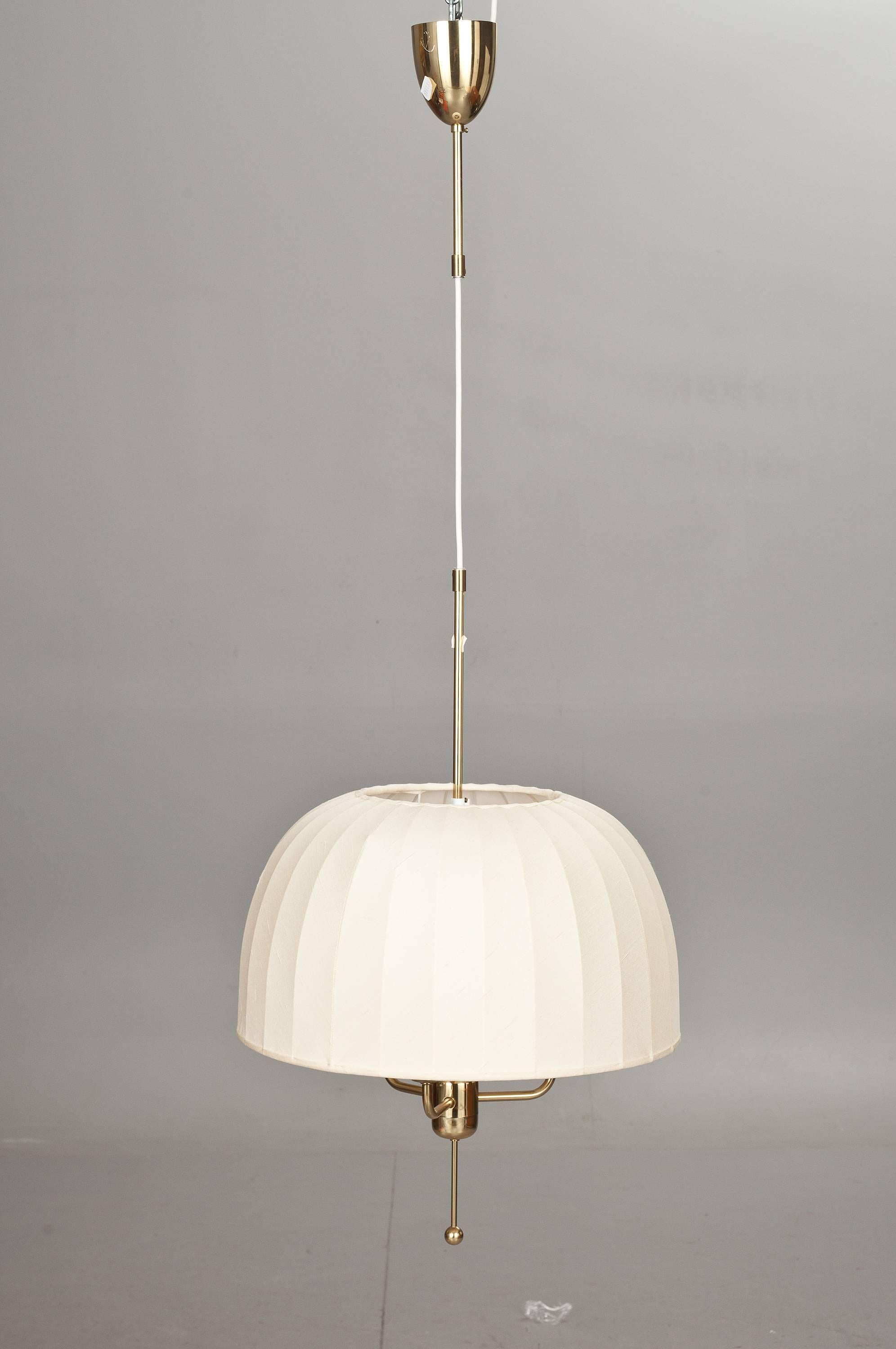 A pendant designed by Hans-Agne Jakobsson, Sweden, circa 1970.
Silk shade with brass hardware. Marked by manufacturer.
Existing electrical wires, we do not guaranty functionality, rewiring available upon request. The shade diameter 17.75