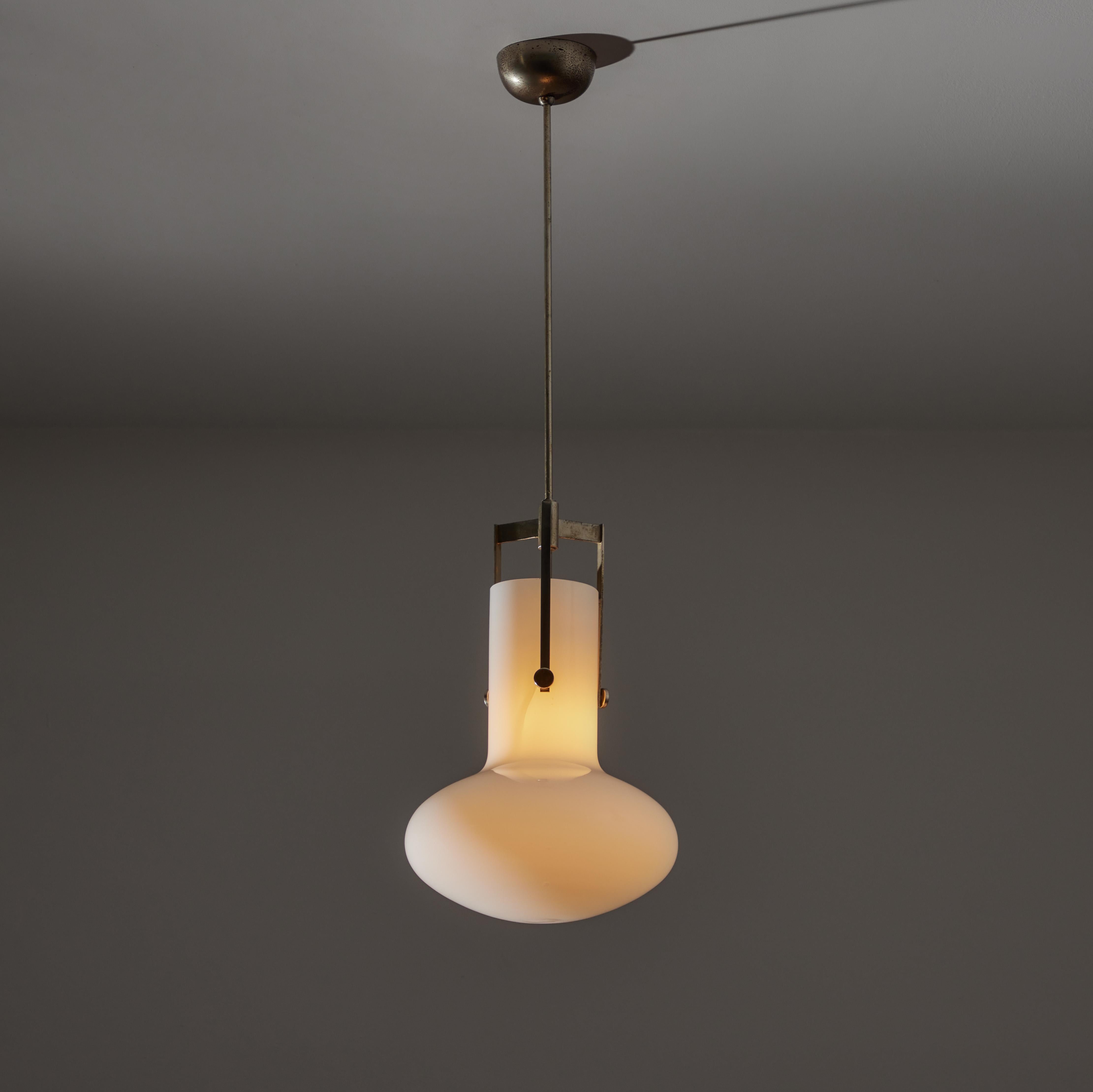 Ceiling light by Ignazio Gardella for Azucena. Designed and manufactured in Italy, in 1958. Opaline glass diffuser with patinated brass armature. Wired for U.S. standards. Original canopy with custom brass ceiling plate. Holds one E27 socket type,