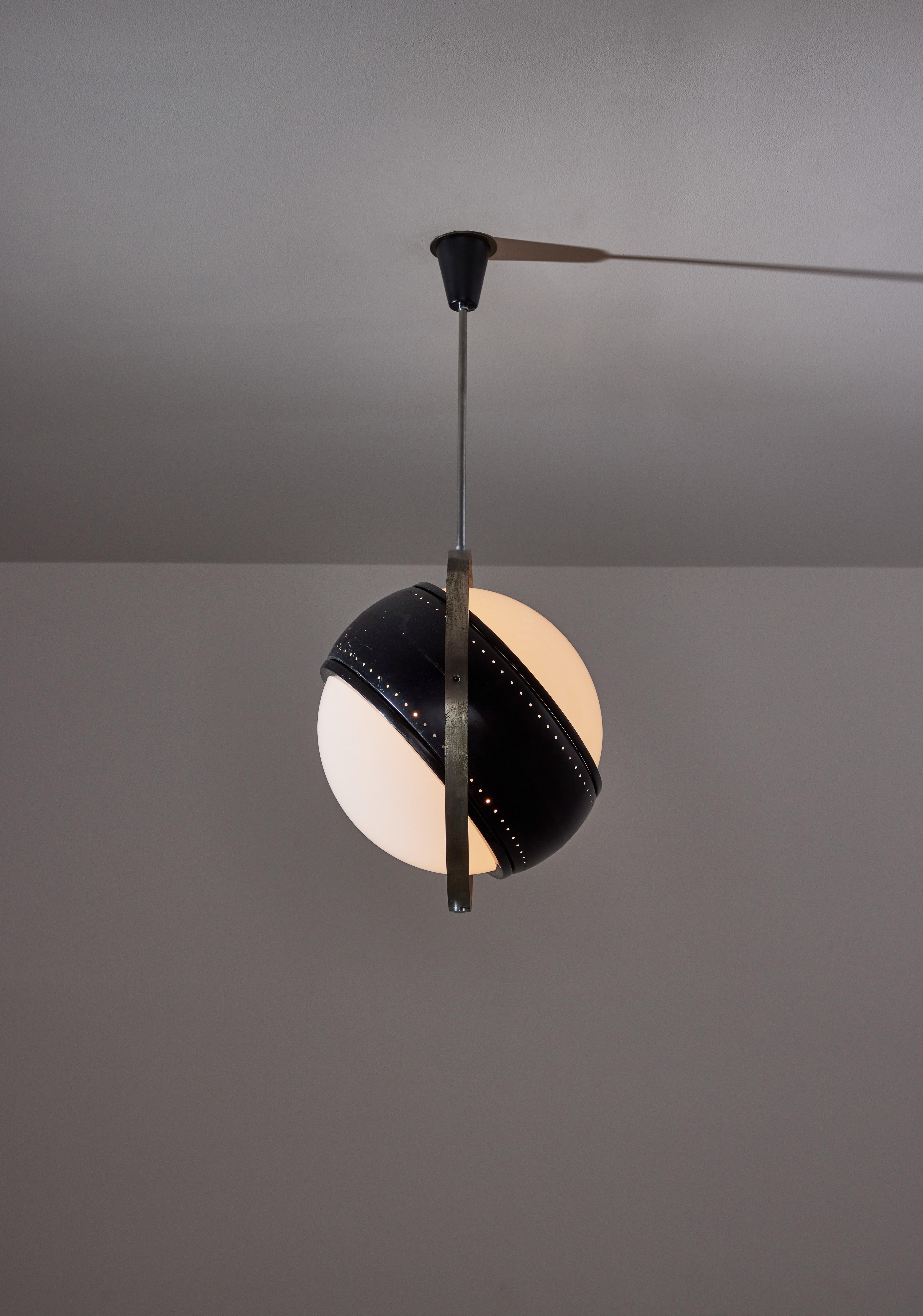 Pendant by Oscar Torlasco. Designed and manufactured in Italy, circa 1950's. Nickel plated brass, painted metal, opaline glass diffuser. Original canopy, custom brass backplate. We recommend four E27 40w maximum bulbs. Bulbs provided as a one time