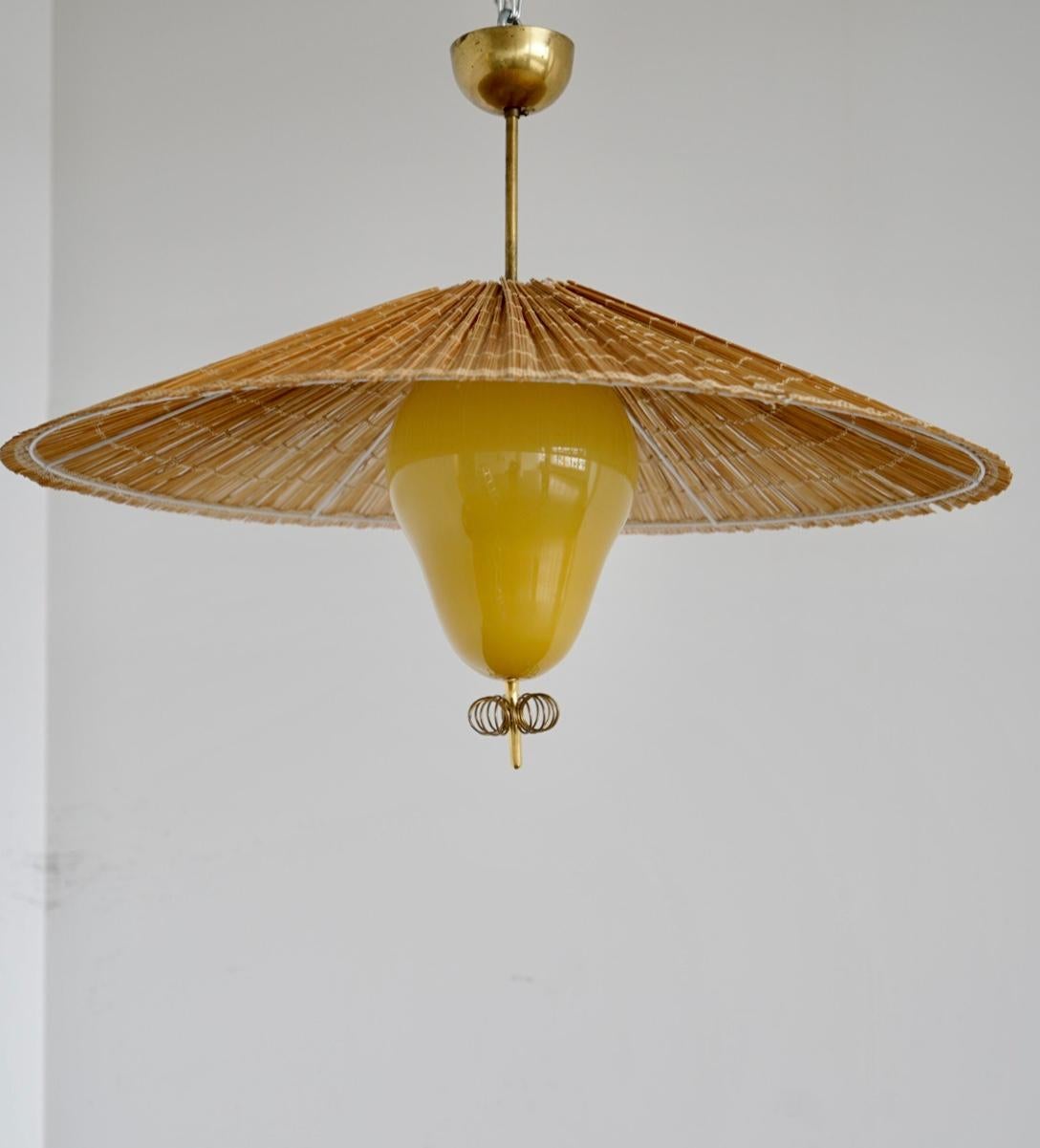 A large pendant designed by Paavo Tynell for Taito Oy. Model 1090. Finland.
 Marked by manufacturer.
Rewiring available upon request. The glass shade height 12