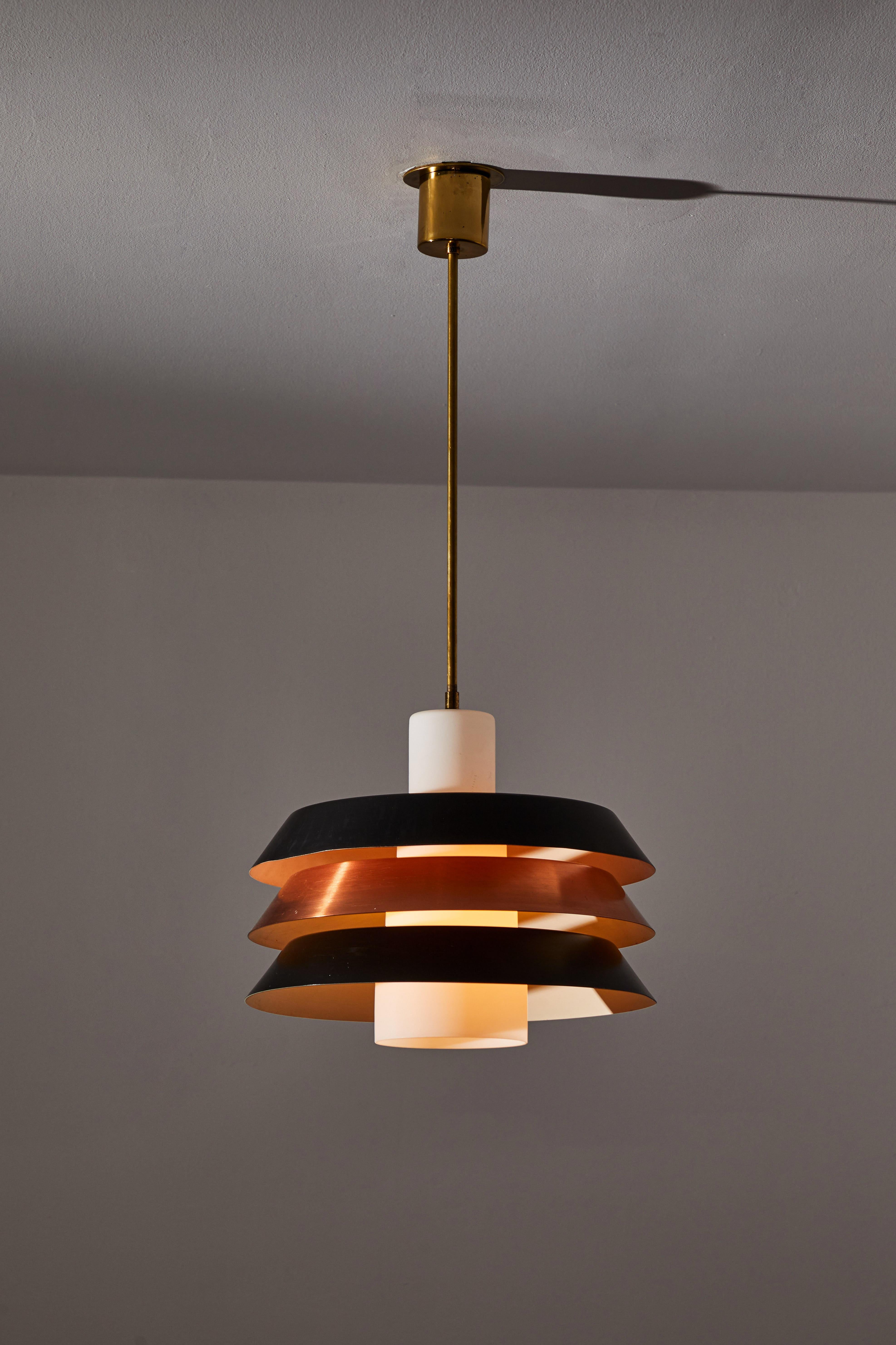 Pendant in the style of Stilnovo. Manufactured in Italy, circa the 1960s. Lacquered metal, copper, and glass. Rewired for U.S. standards. Original canopy, custom brass ceiling plate. We recommend one E27 100w maximum bulb. Bulb is provided as a