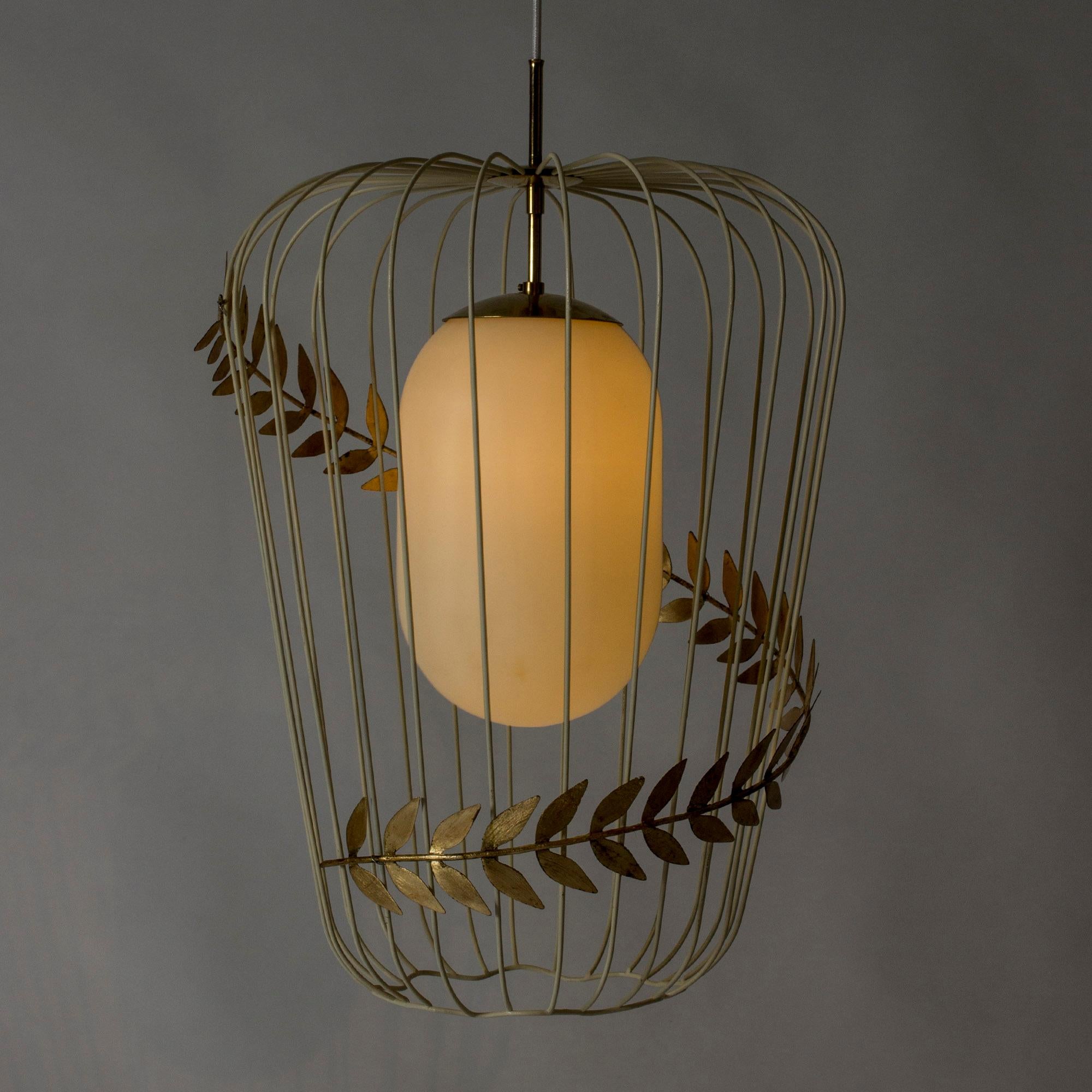 Stunning, rare ceiling lamp by Hans Bergström. The white lacquered metal cage, elegantly encircled by a golden olive wreath, encloses a large opaline light shade. Amazing when lit. Refined in execution, a real centrepiece.

Hans Bergström was the