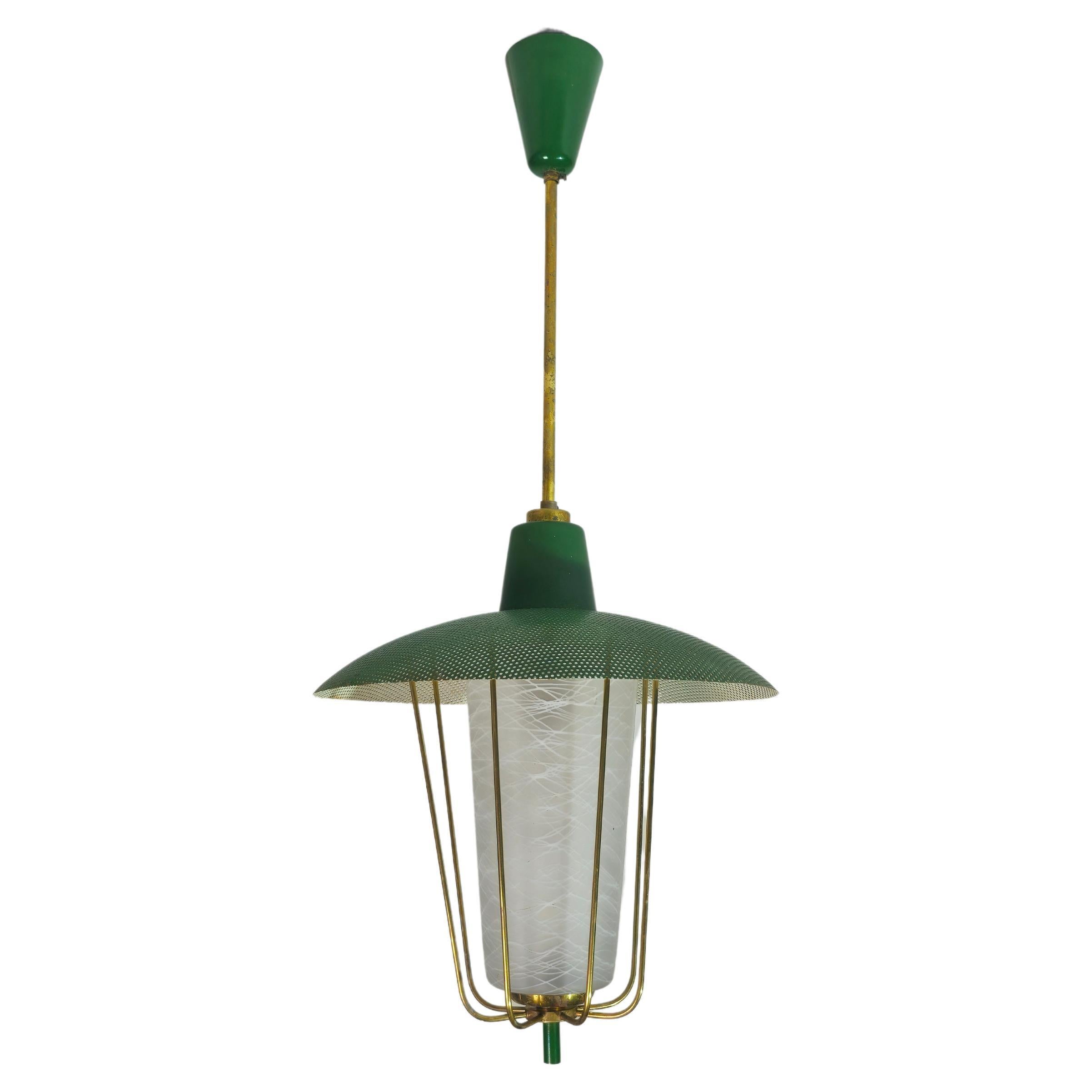 Pendant lamp with lantern body. It has a satin glass decorated with milky filaments, surrounded by brass rods that support a green enamelled micro-perforated diffuser. Brass and metal accessories. Italy of the 50s. Please watch the video and photos