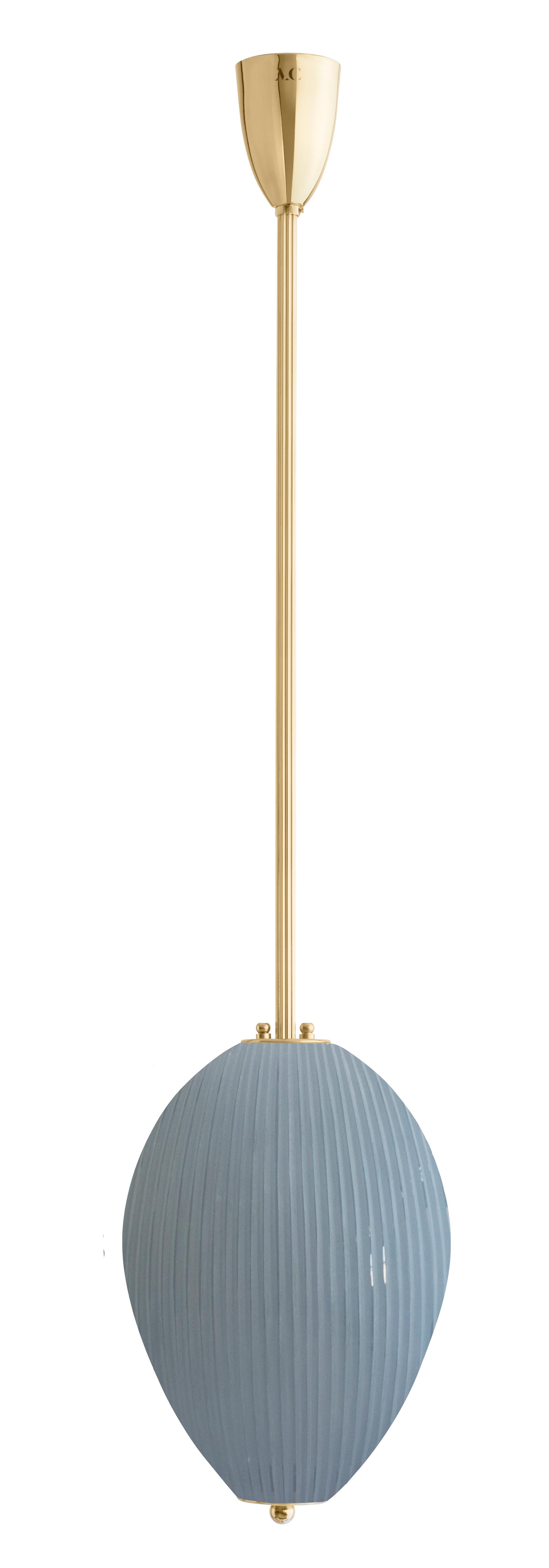 Pendant China 10 by Magic Circus Editions
Dimensions: H 90 x W 32 x D 32 cm, also available in H 110, 130, 150, 175, 190 cm
Materials: Brass, mouth blown glass sculpted with a diamond saw
Colour: opal grey

Available finishes: Brass,