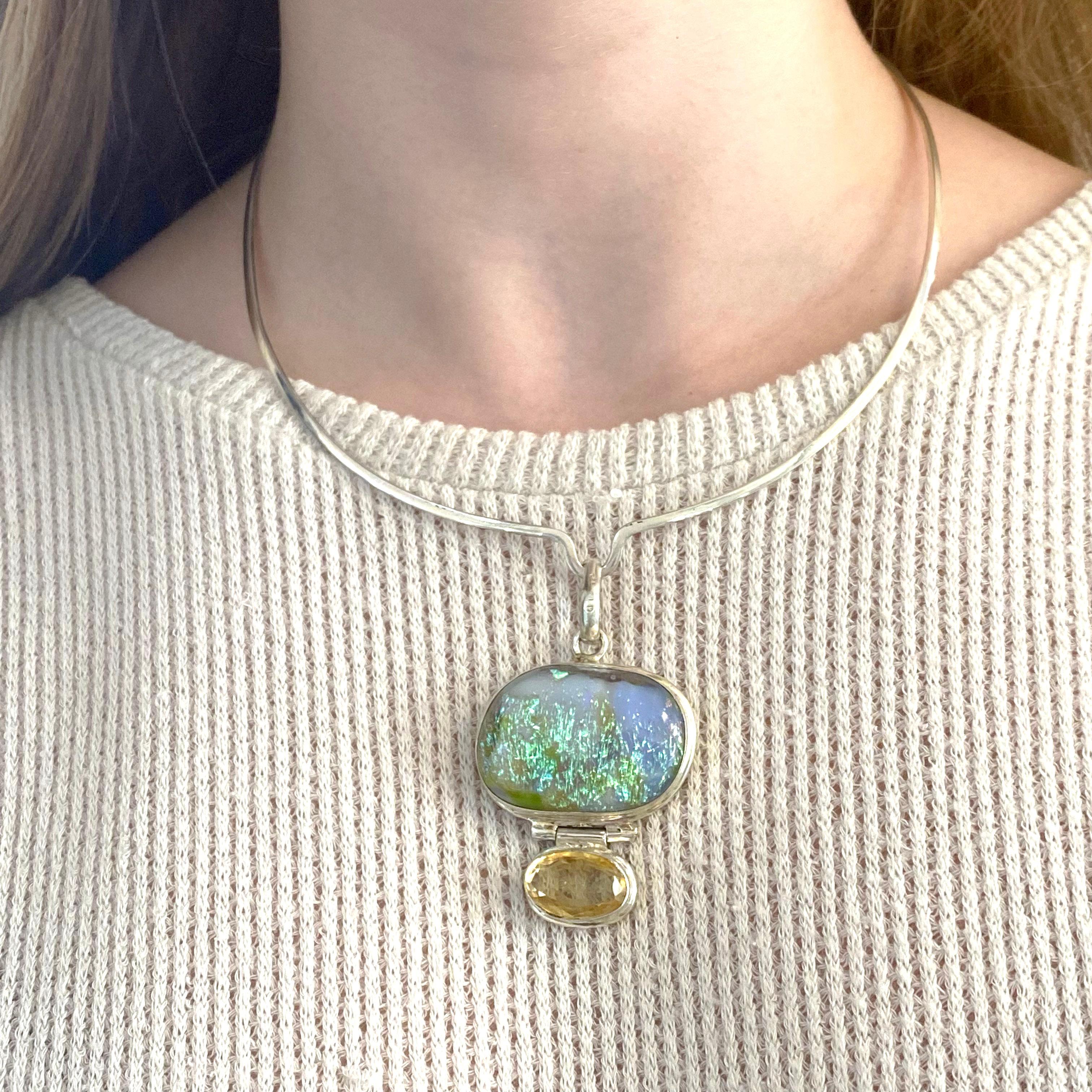 The blue and green iridescence is gorgeous and is set in a perfectly made bezel with a smaller genuine citrine at the bottom. The sterling silver color has a nice clasp on the back and can be used with other pendants. Metal Quality: Sterling