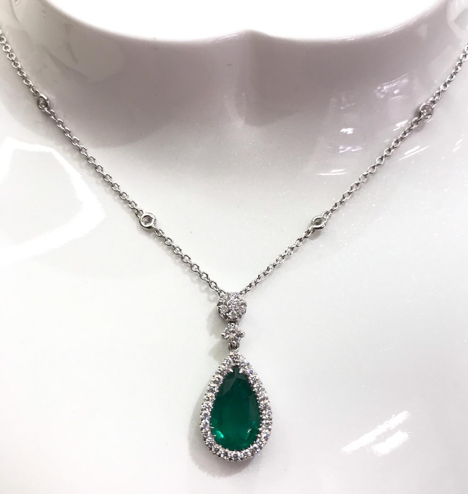 Pendant with a Certified Drop Emerald, Diamonds and Pear Cut Emerald on Top.
Delicious Cut, Proportion and Brightness for the Emerald ct. 1.81 Vivid Green Pear-Shape Mixed Cut Transparent. Diamonds on the chain. 
Diamonds around the Emerald are ct.