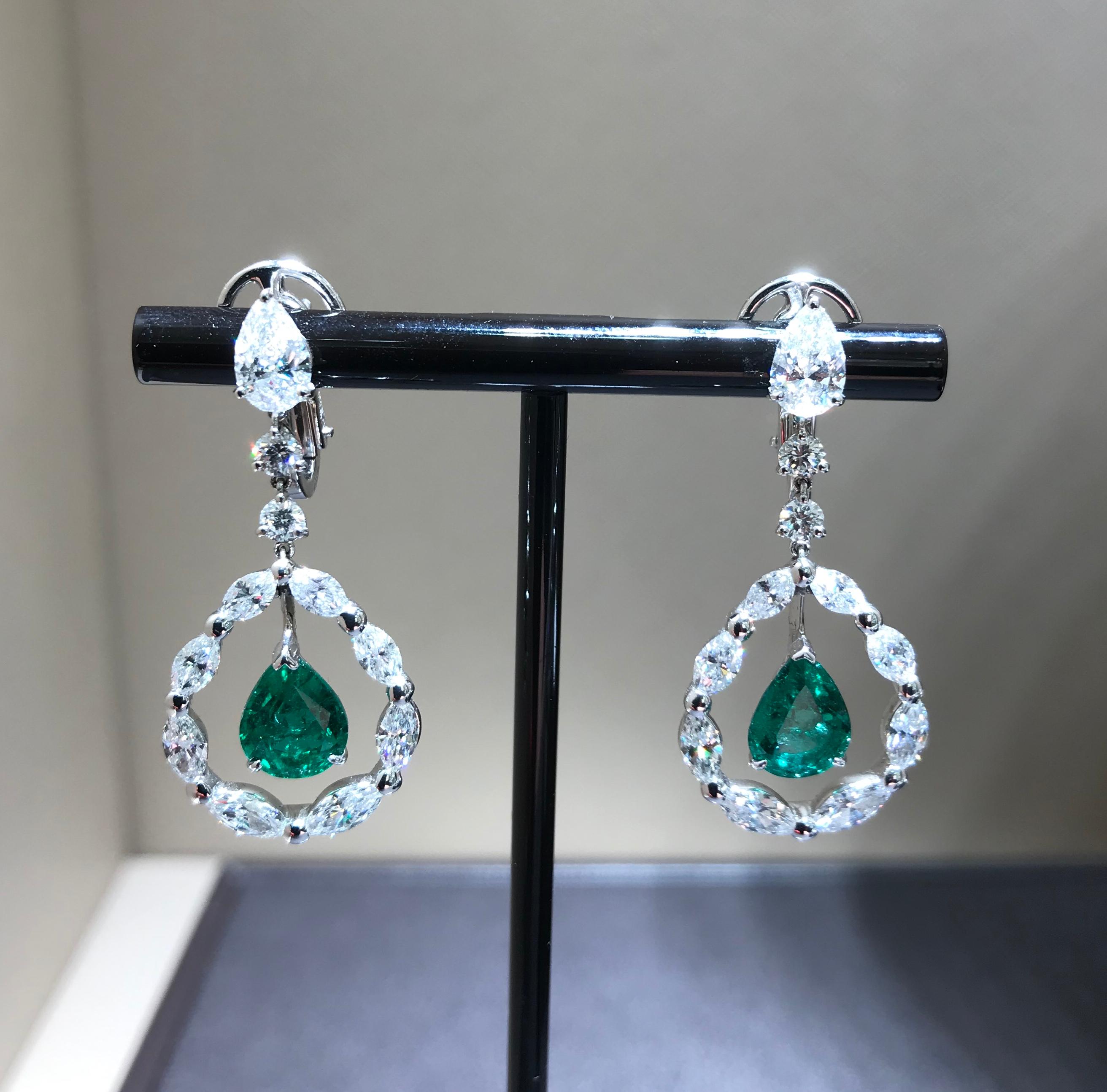 Contemporary Pendant Drop Emerald Earrings in a Circle of Navette Diamonds and Solitaire For Sale
