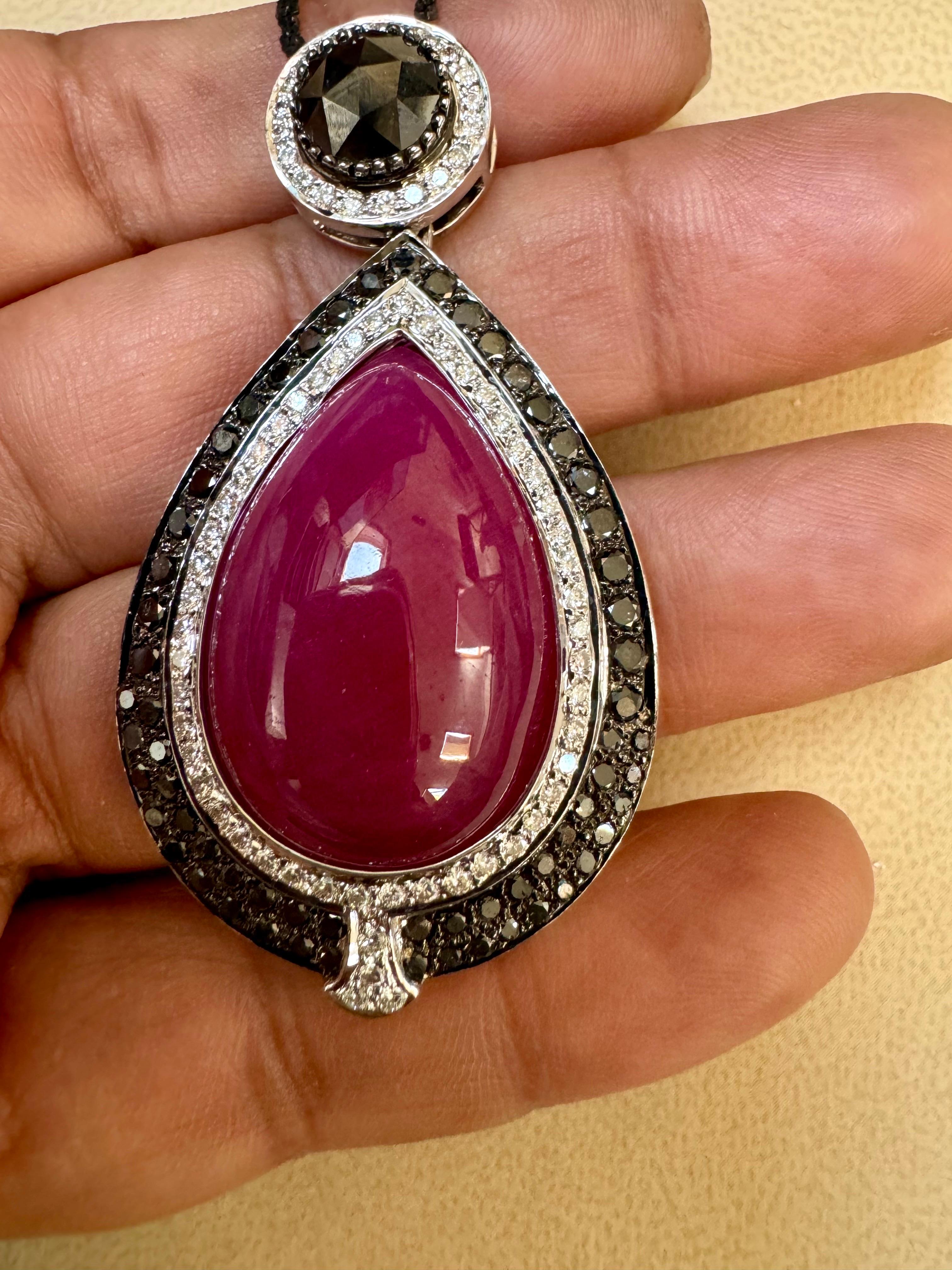  Pendant & Earring Suite 60Ct Natural Ruby No Heat & Black & White Diamond 18KWG
This Large eye catching Pendant Necklace with matching earrings are  crafted from 18 Karat gold and features large Pear-shaped  natural Rubies, totaling approximately 