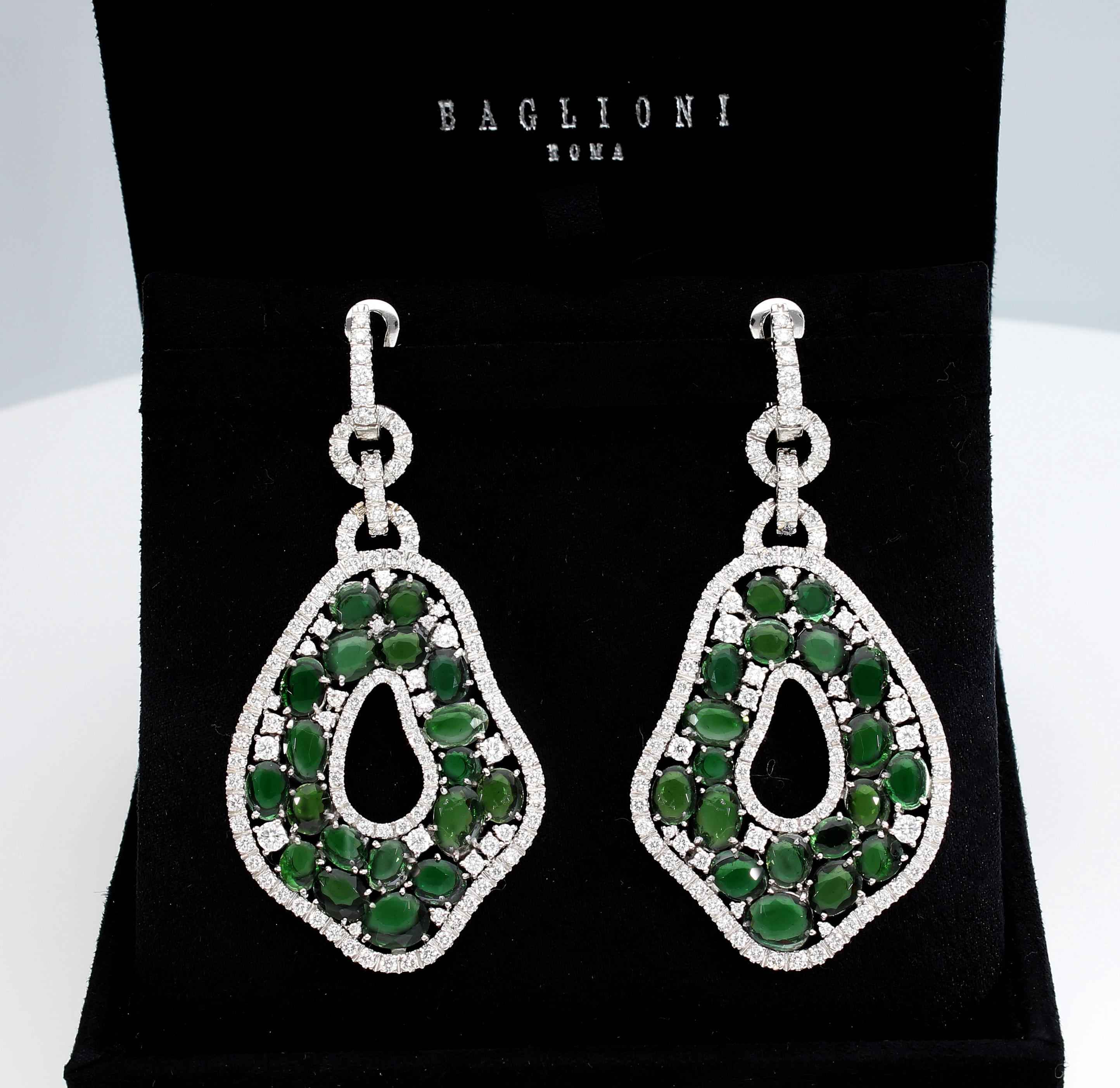 Extremely flat pendant earrings, with brilliant cut diamonds total weight ct 5.95 and green tourmalines oval cut total weight ct 15.38. 
The earrings have a pin closure for pierced ears.
The closure can be customized for lobes without holes.
The