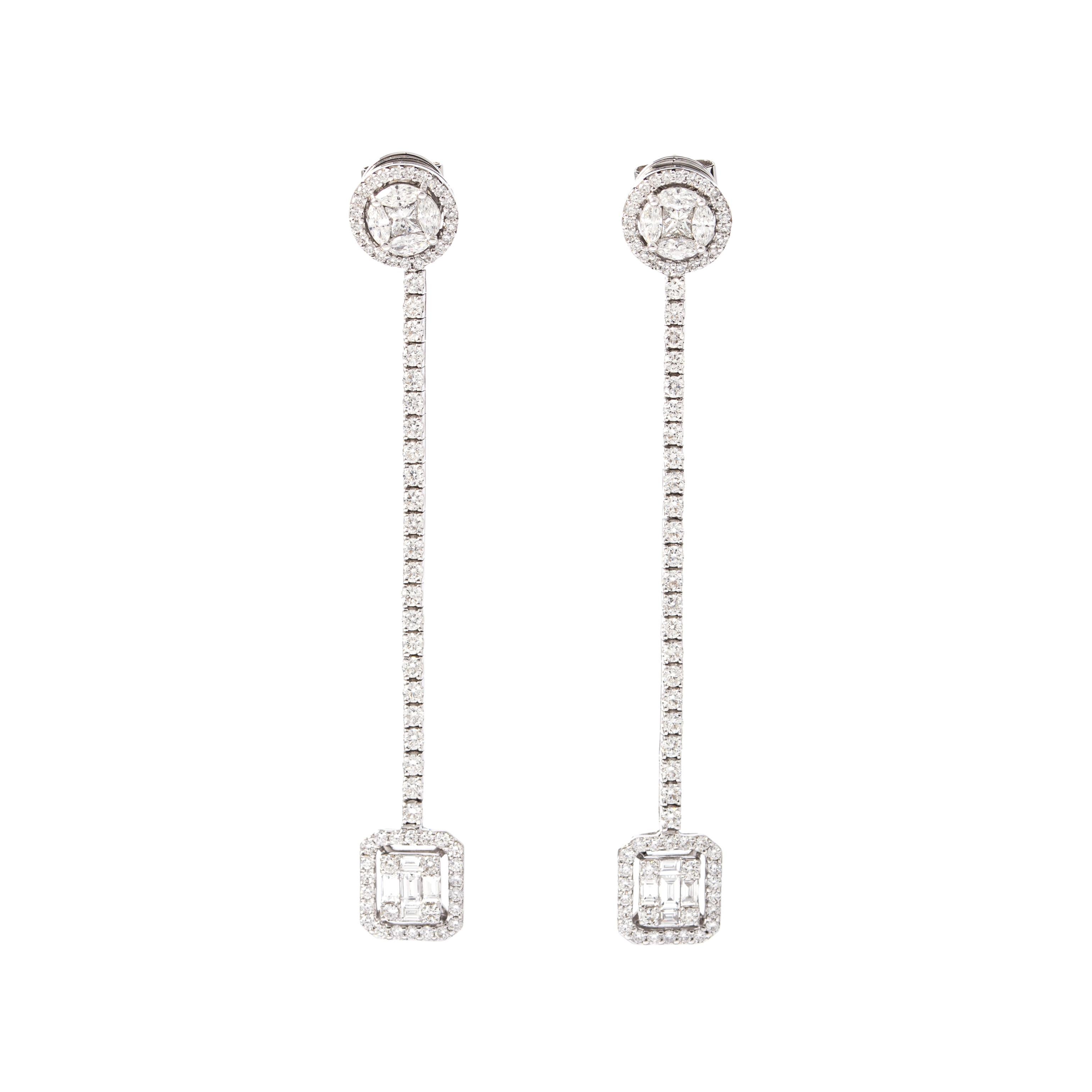 Earrings in 18kt white gold set with 20 baguette, marquise and pear-shaped cut diamonds 0.89 cts and 144 diamonds 1.47 cts.

Length: 6.20 centimeters (2.44 inches). 

Maximum Width: 0.90 centimeters (0.35 inches).

Total weight: 7.47 grams. 