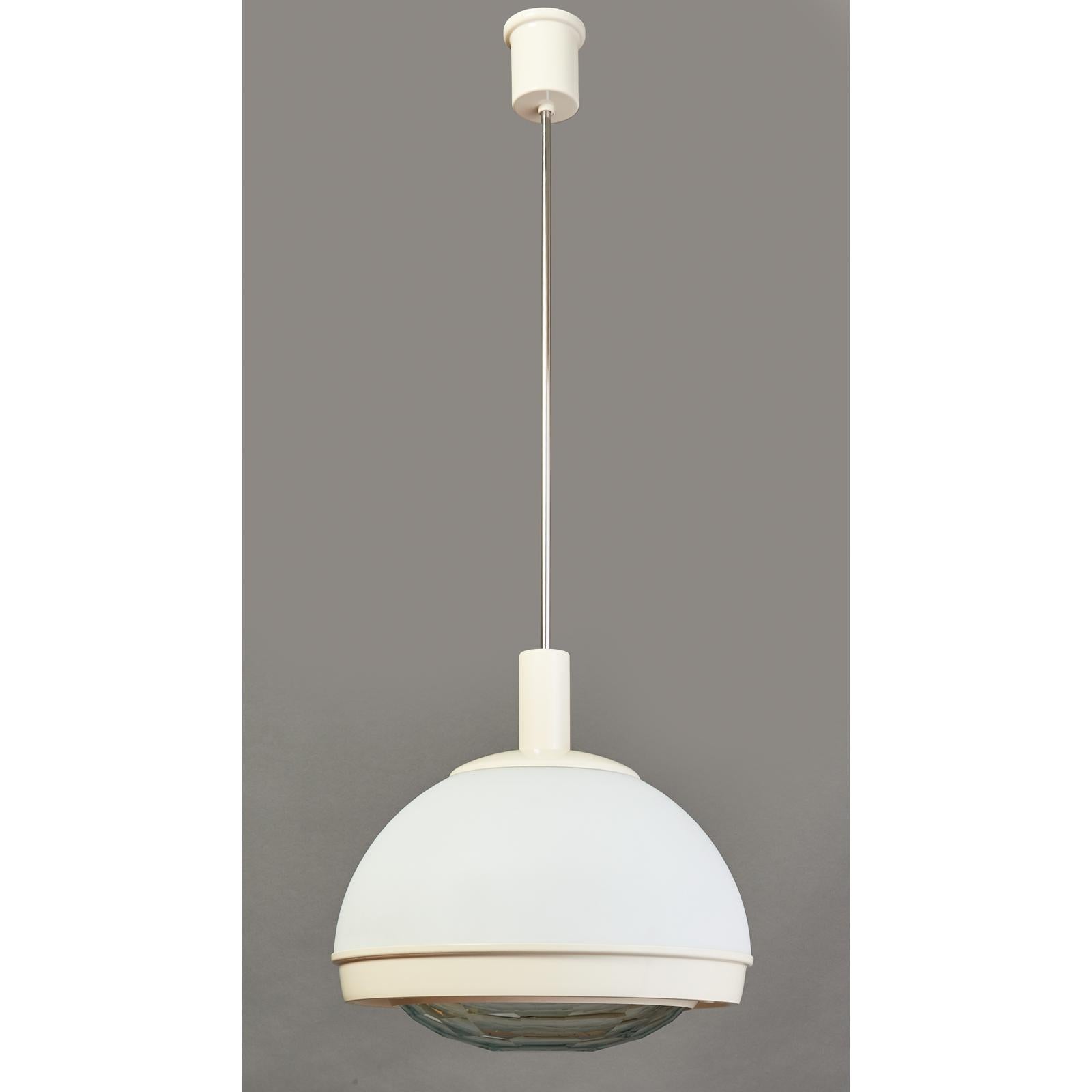 Italy, 1960s.
Pendant white glass chandelier with faceted glass lens, enameled and nickeled metal mounts.
Dimensions: 16 diameter x 39 height
Rewired for use in the USA with four standard base bulbs, one down light in lower chamber with faceted
