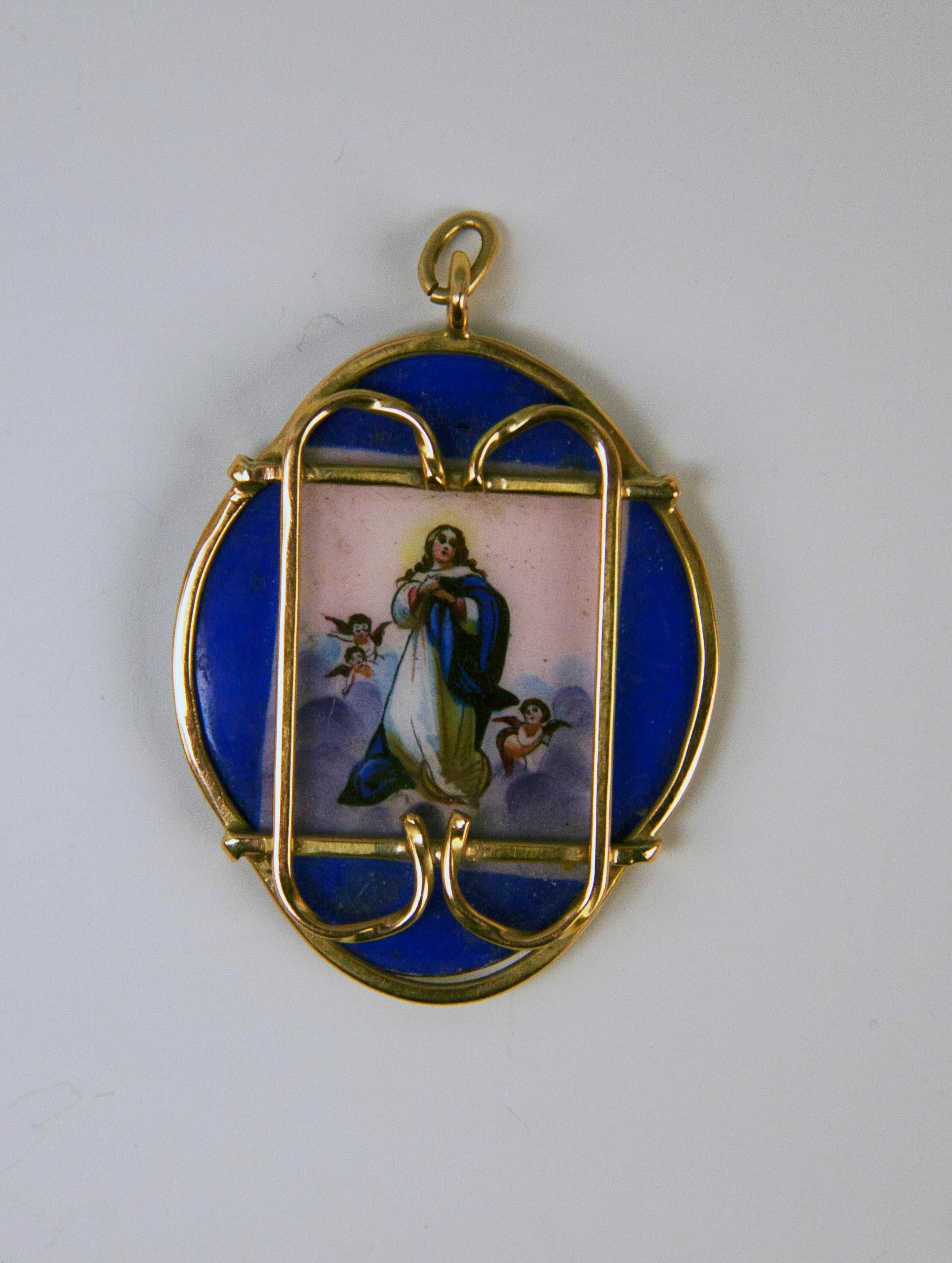 Golden Pendant of interesting appearance, manufactured as following:
Pendant made of porcelain is of oval form type, framed by golden edging. The pendant's front side is painted (= enamel painting)  with picture of VIRGIN MARY - clad in white dress