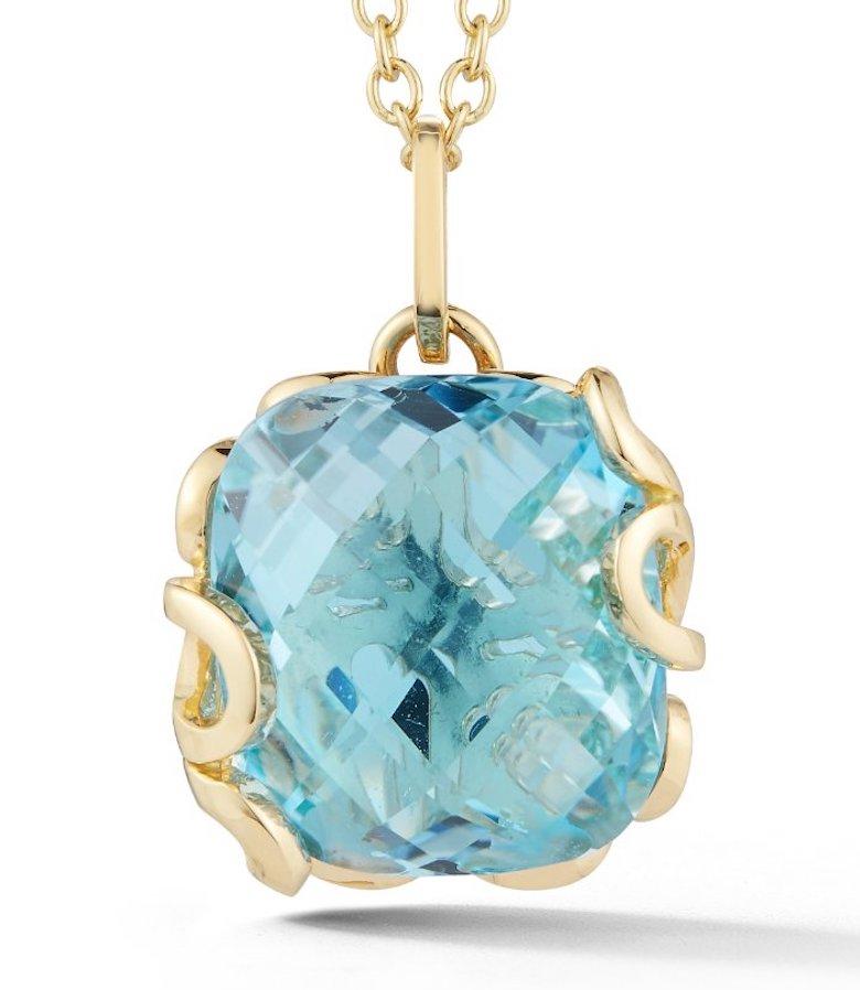 Sea Leaf pendant in 18K yellow gold with leaf motif back and large blue topaz center stone
