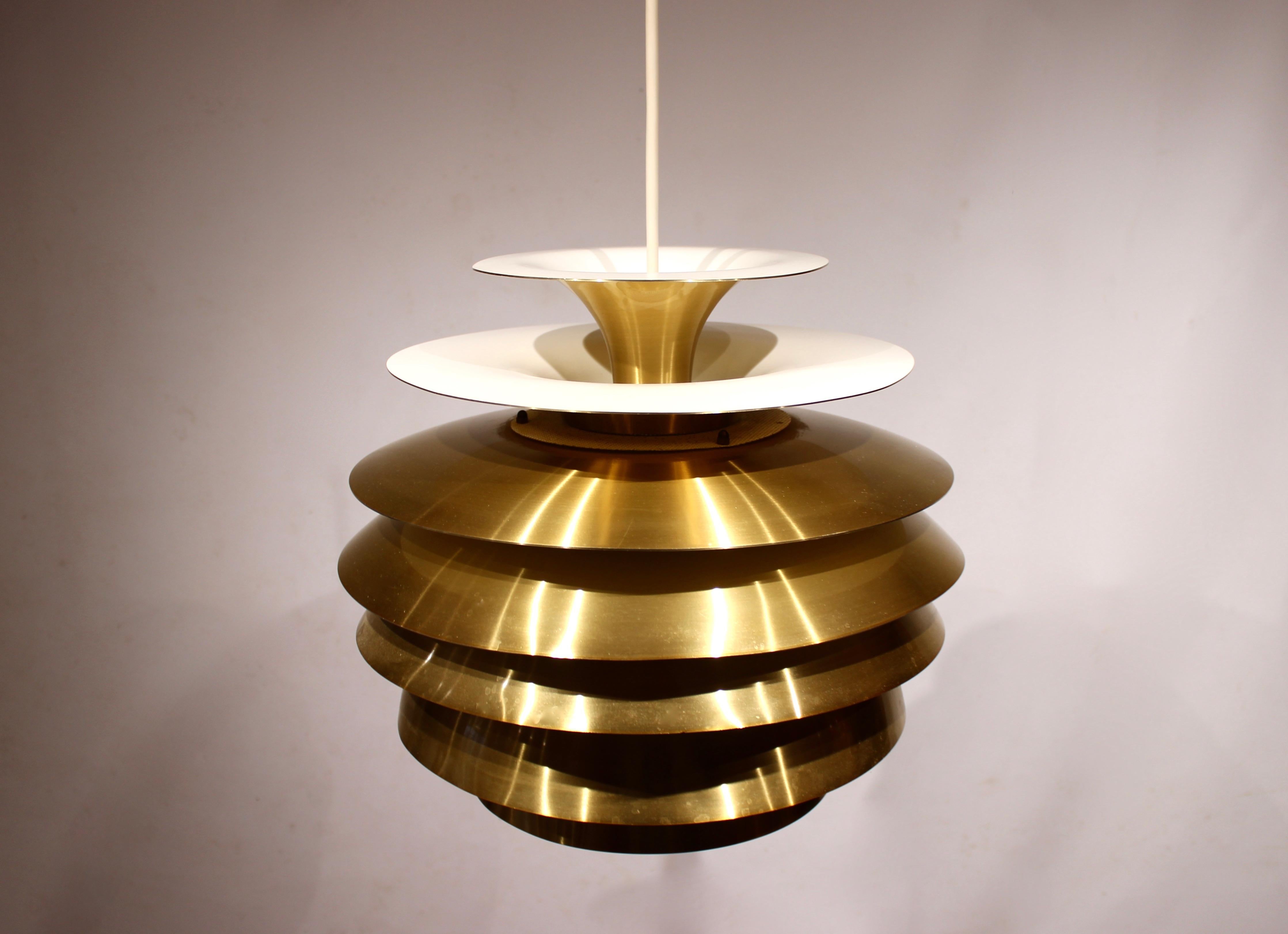 Pendant in brass by Bent Karlby from the 1960s. The lamp is in great vintage condition.