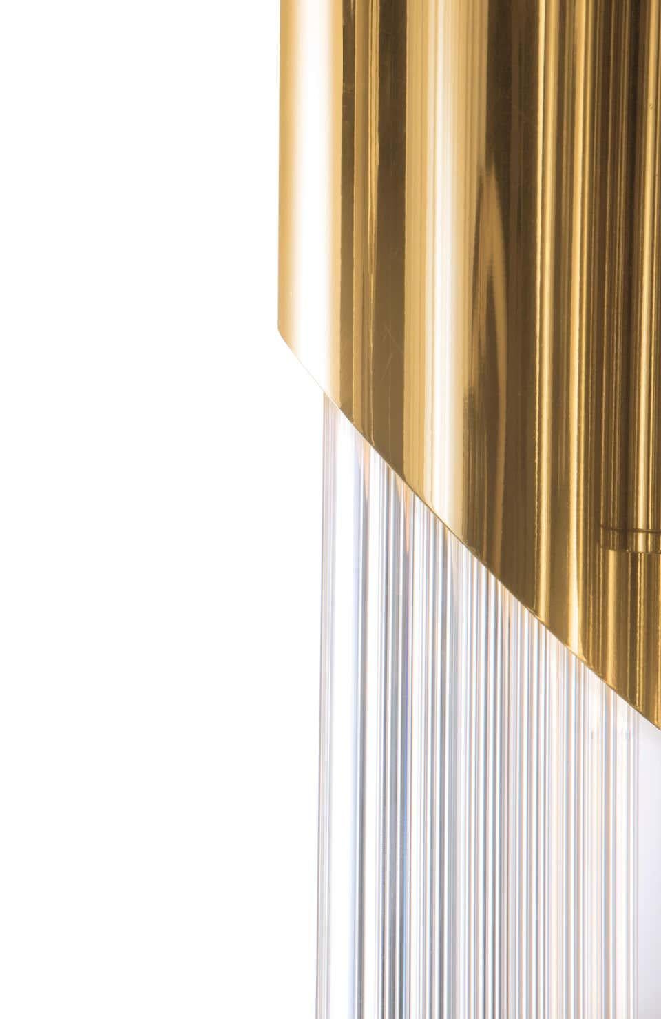 Its structure has 3 tubes like the original inspiration made in brass and crystal glass. Transmitting elegance and purity to every space, the reception or lobby areas can be a perfect place for this gorgeous masterpiece.

Materials
Body: Brass and