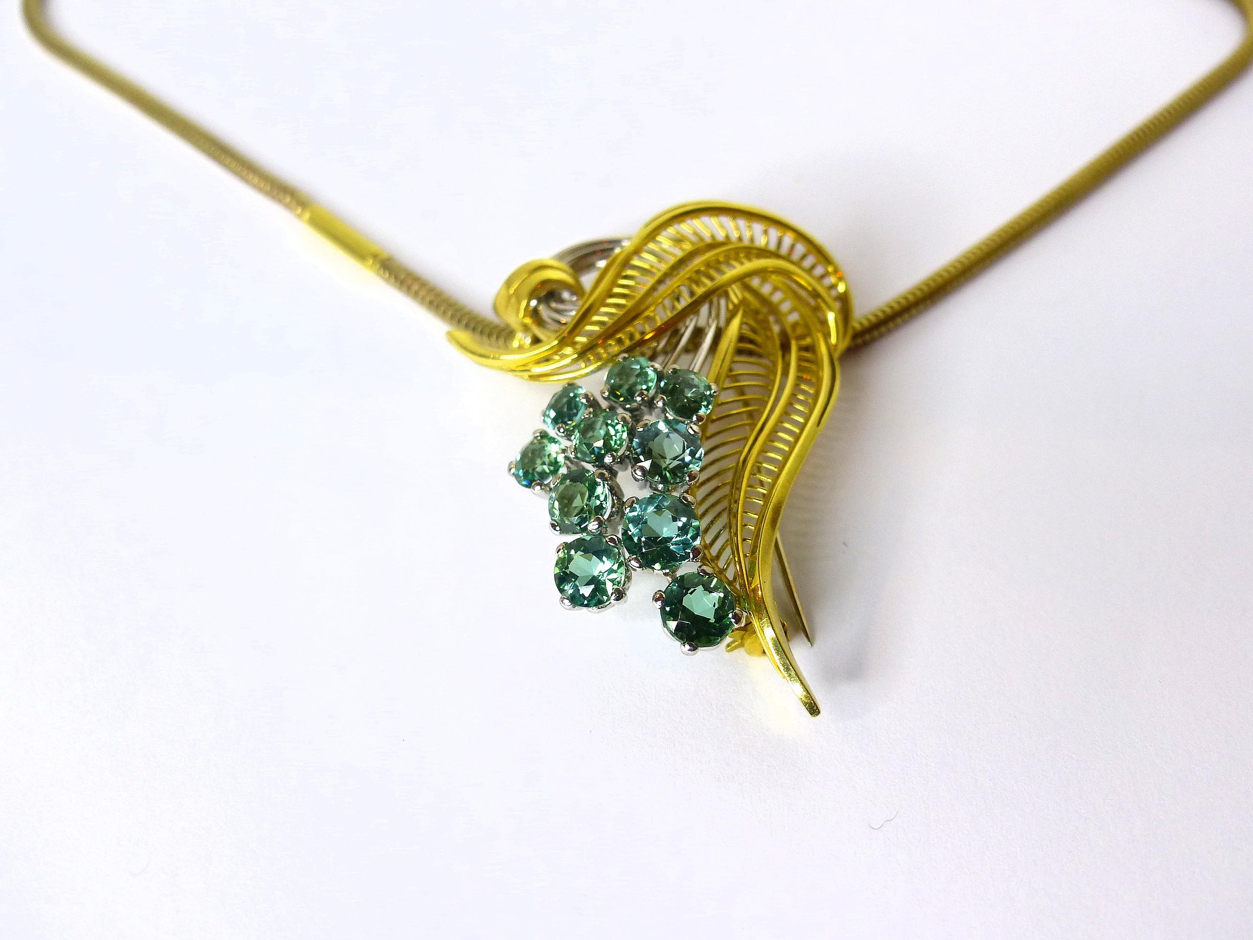 Thomas Leyser is renowned for his contemporary jewellery designs utilizing fine gemstones.

This 14k yellow gold pendant 27,47gr. is set with 10 top quality green Tourmalines round facetted 5,5mm, with 5,10ct. in magnificient blueish/greenish colour