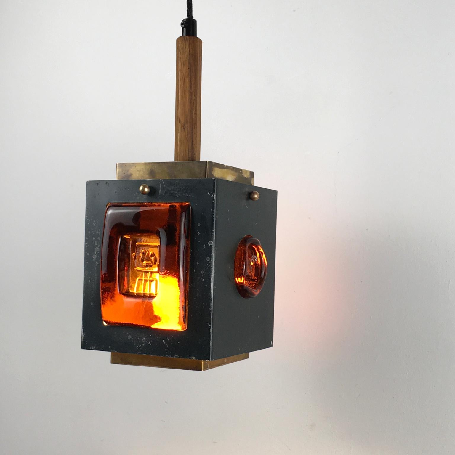 1960s Sweden suspension or pendant lamp, designed by Einar Backström and Erik Höglund for the glassmaker Boda Glasbruk (later known as Kosta Boda).
The enamel painted metal frame shows slight scratches and wear from previous use but the structure