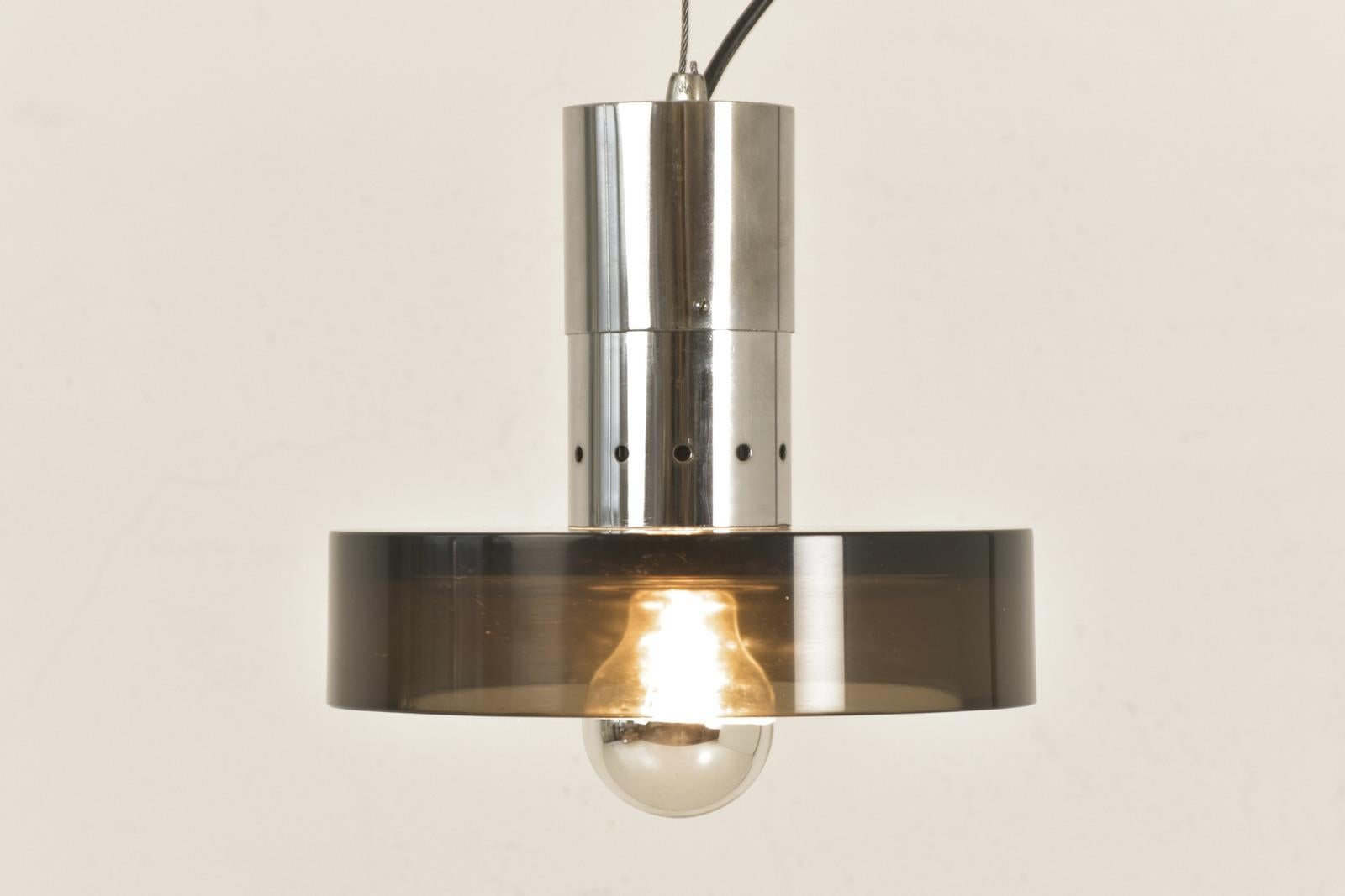 H 250 cm W 25 cm D 25 cm

Material: chrome-plated brass, reflector brown translucent glass, cast, ground and polished, one E 27 light point, head-mirrored bulb (also available as LED) steel cable, plastic connection cable, original