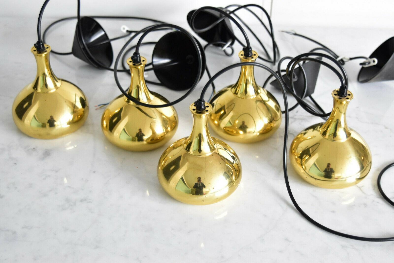 Small pendant light in brass designed by Hans-Agne Jakobsson and manufactured by Markaryd AB in Sweden during the late 1950s. The lamp comes with a new black plastic cord and a black ceiling rose. Ready to use worldwide with E14 Edison socket. Very