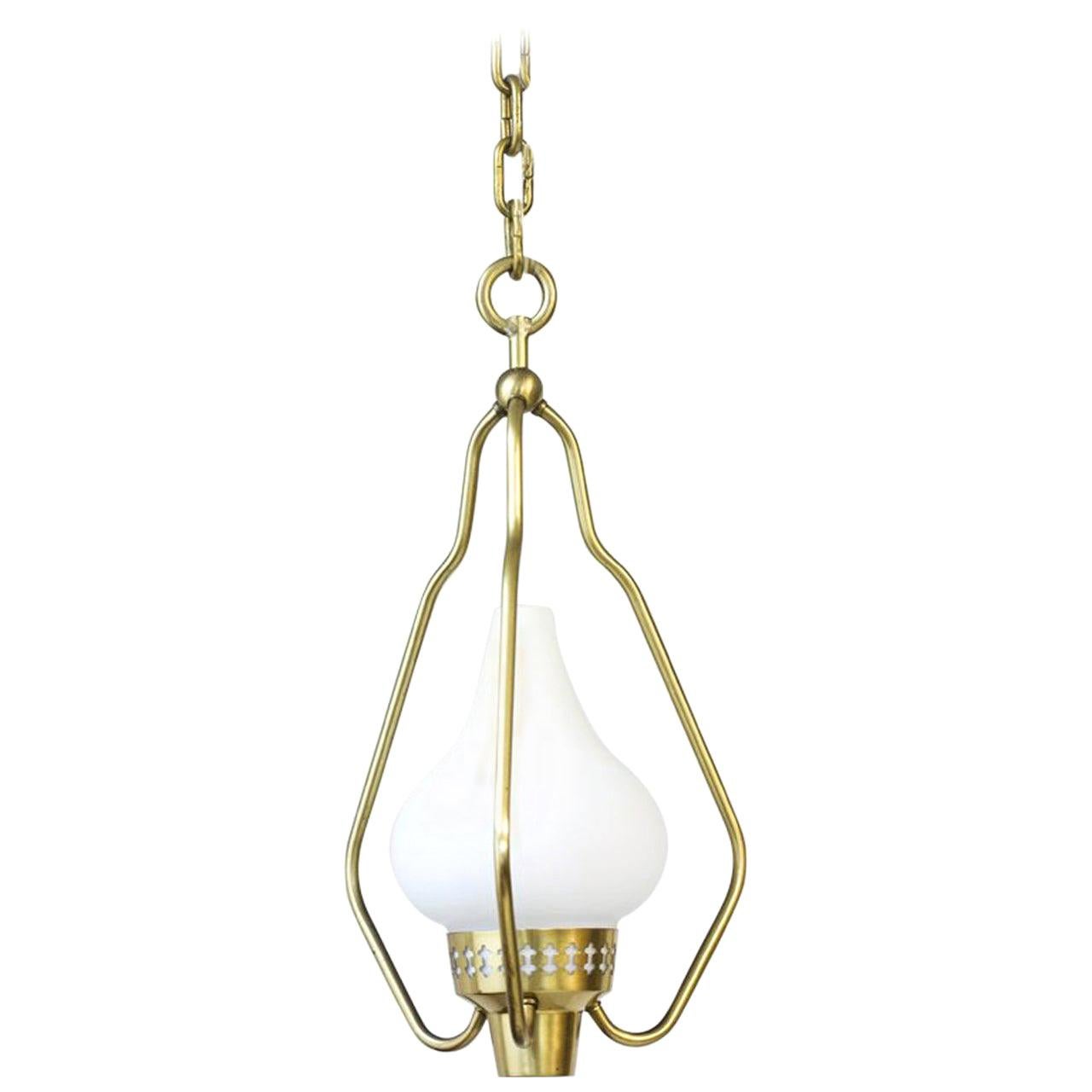 Pendant lamp designed by Hans Bergström, 
manufactured by ASEA in Sweden during the 1950s.
Brass chain and frame with opaline glass shade.