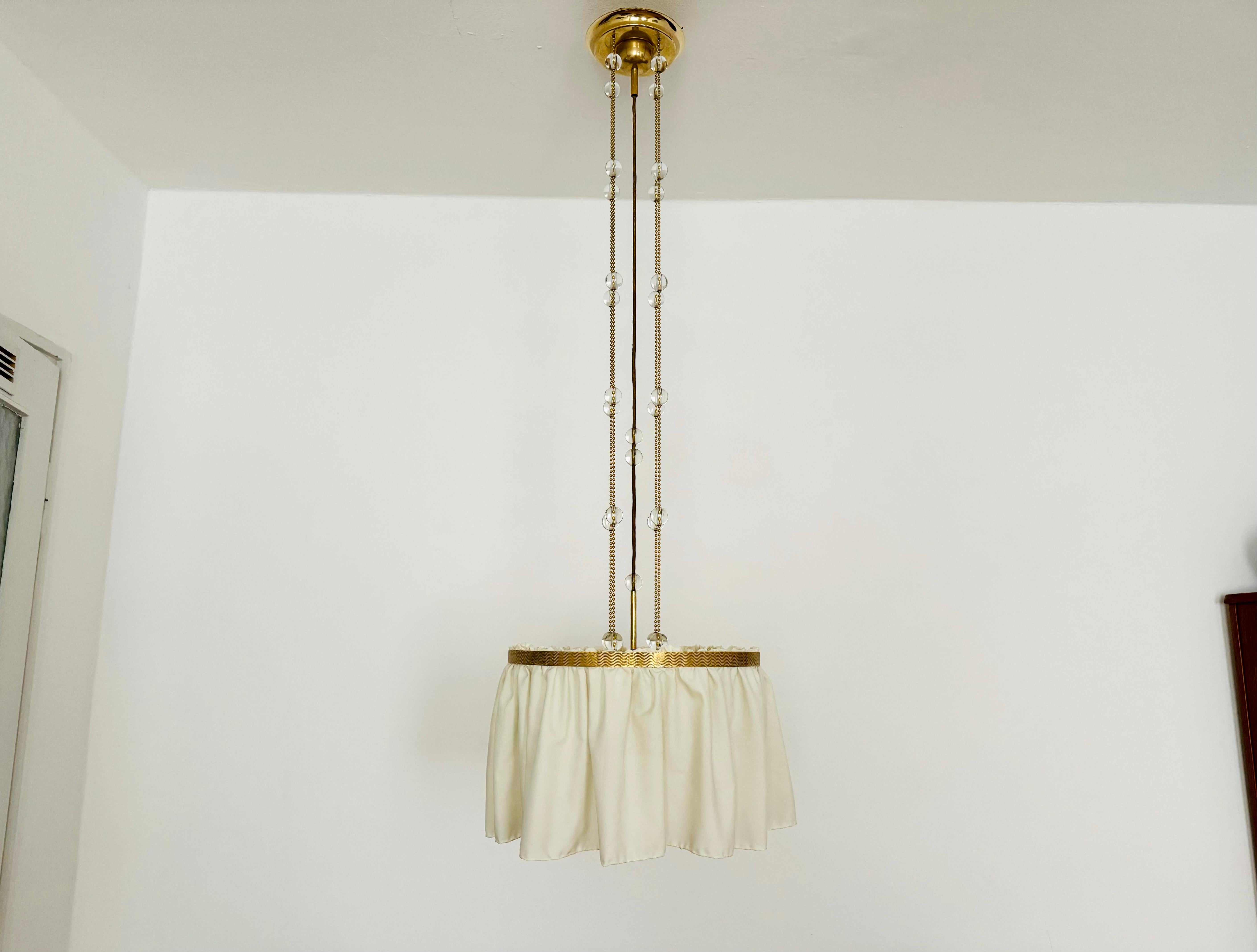 Very rare Vienna Secession pendant lamp, probably a design by Josef Hoffmann or Adolf Loos, crafted from fine silk, brass and crystal glass. This pendant lamp bears strong similarities in form to Hoffman's Wittgenstein lamp (with similar crystal