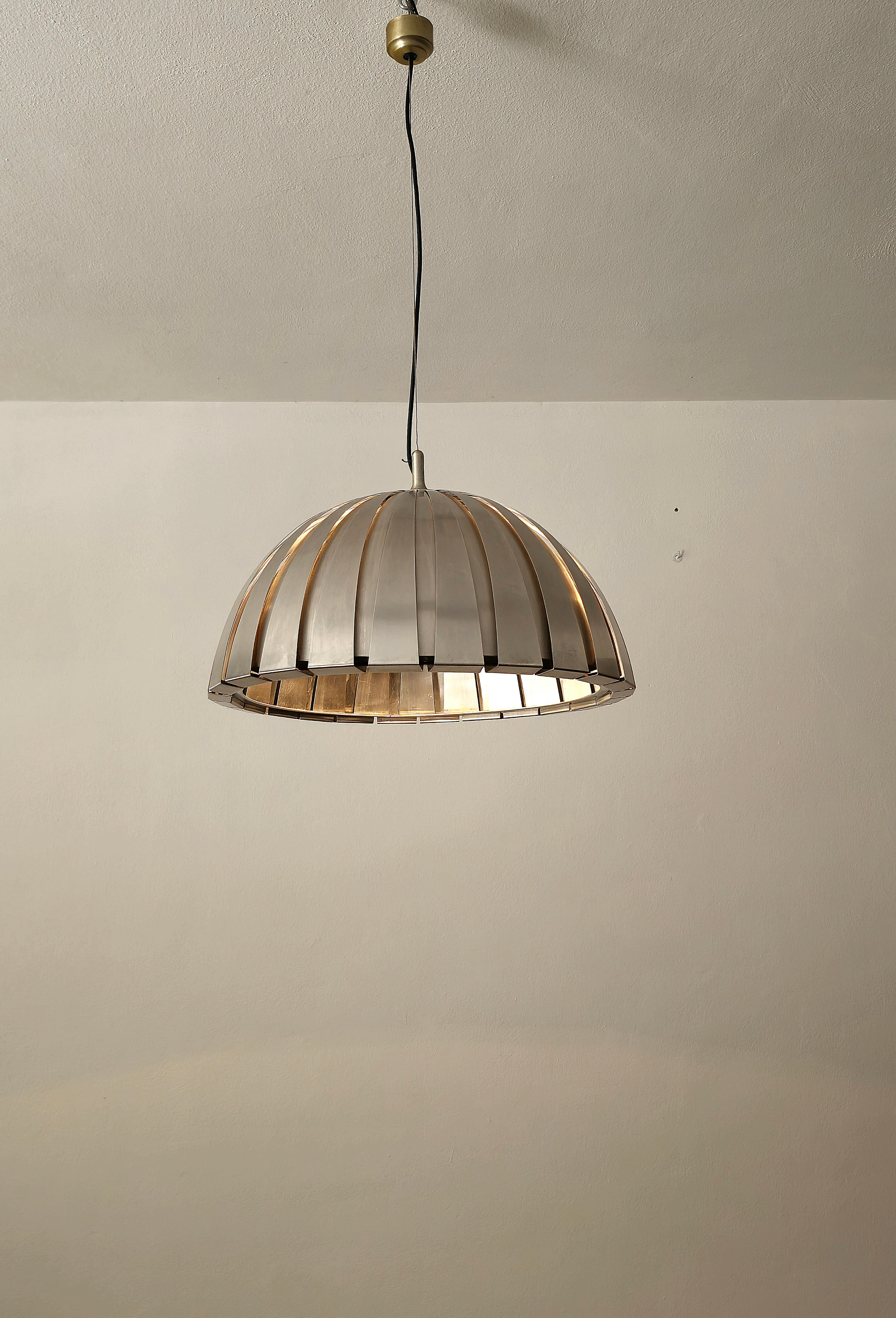 Suspension lamp designed in Italy in the 60s by Elio Martinelli.
The pendant lamp was made of brushed steel with bent and curved bars.


Note: We try to offer our customers an excellent service even in shipments all over the world, collaborating