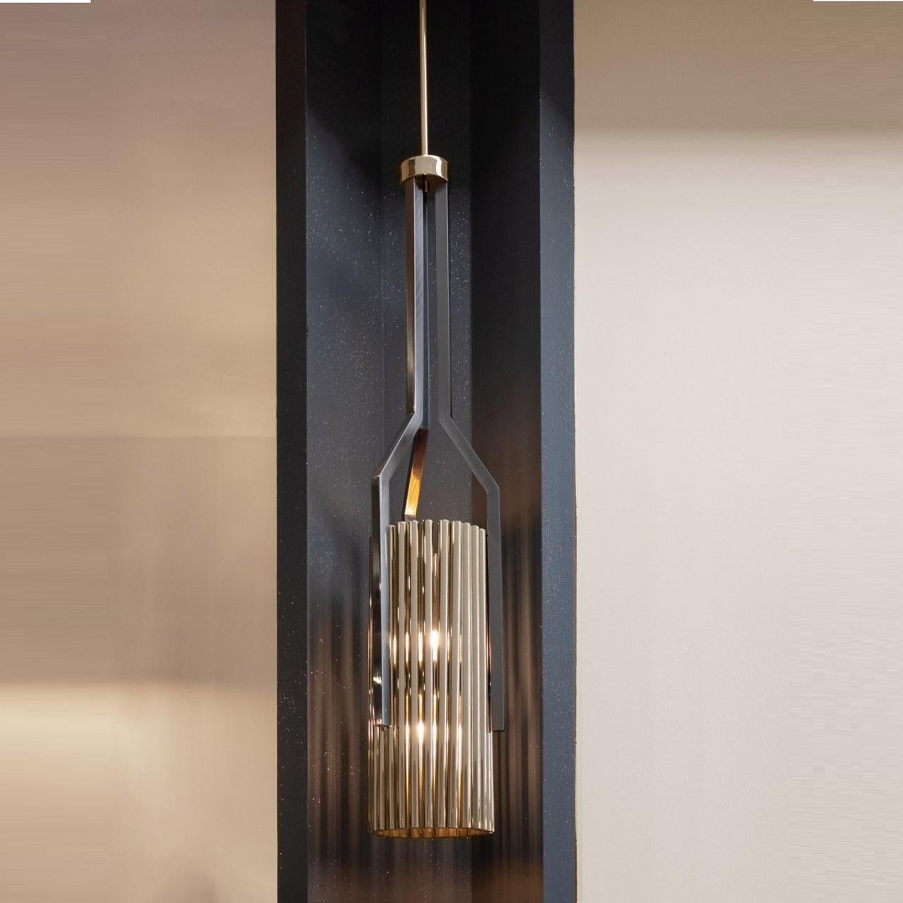This handmade pendant showcases long plated brass tubes in rectangular and circular shapes, with a striking combination of matte and polished plated finishes that give the design an exclusive and captivating appeal. Its distinctive appearance sets