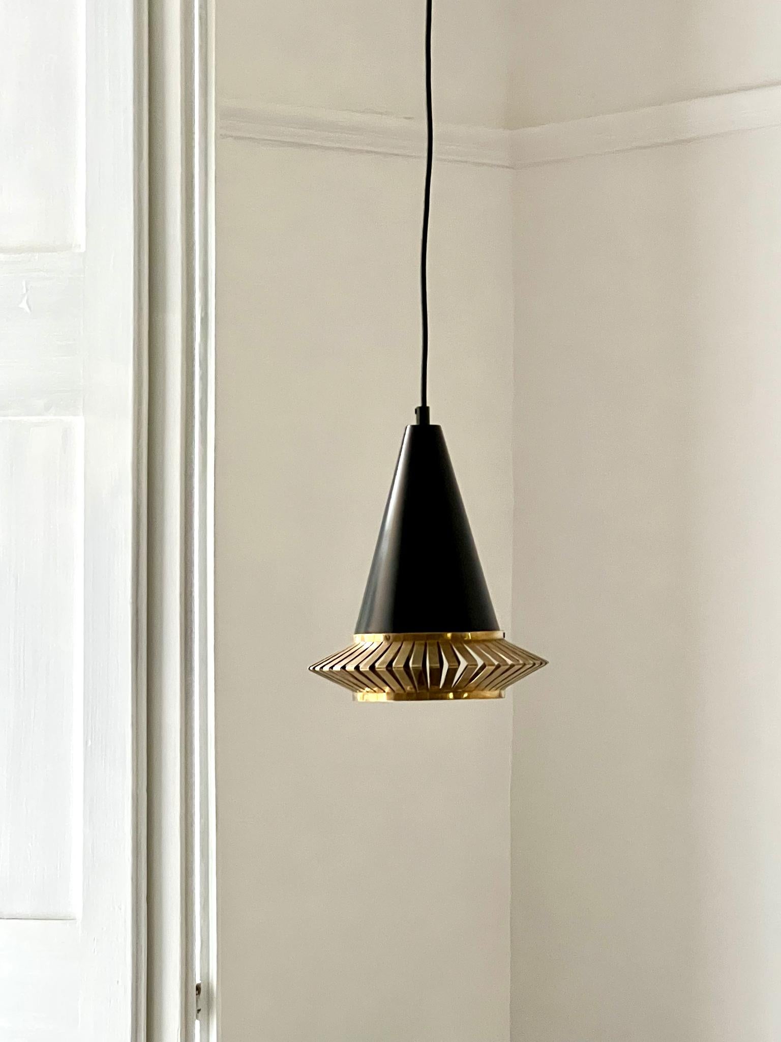 A mid-20th century pendant light by Maria Lindeman for Idman of Finland. The light is illustrated in the Idman catalogue and is model number K 2-1 (small size).

Overall the piece is in good vintage condition. The white finish to the inside of the