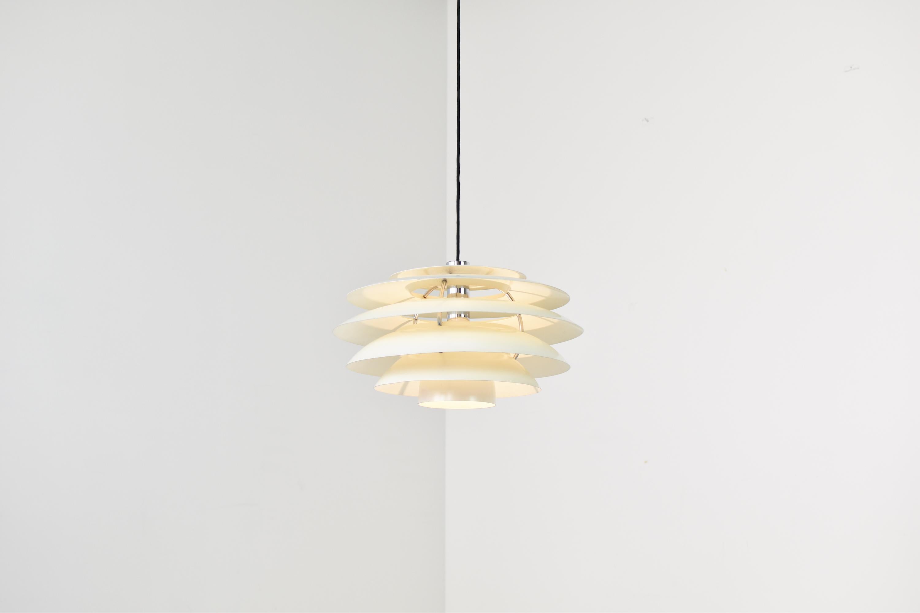 Pendant lamp Model No. 1262 by Stilnovo, Italy 1960s. This lamp features an aluminium structure with aluminium layered shades. Good original condition with only minor wear. Labeled.