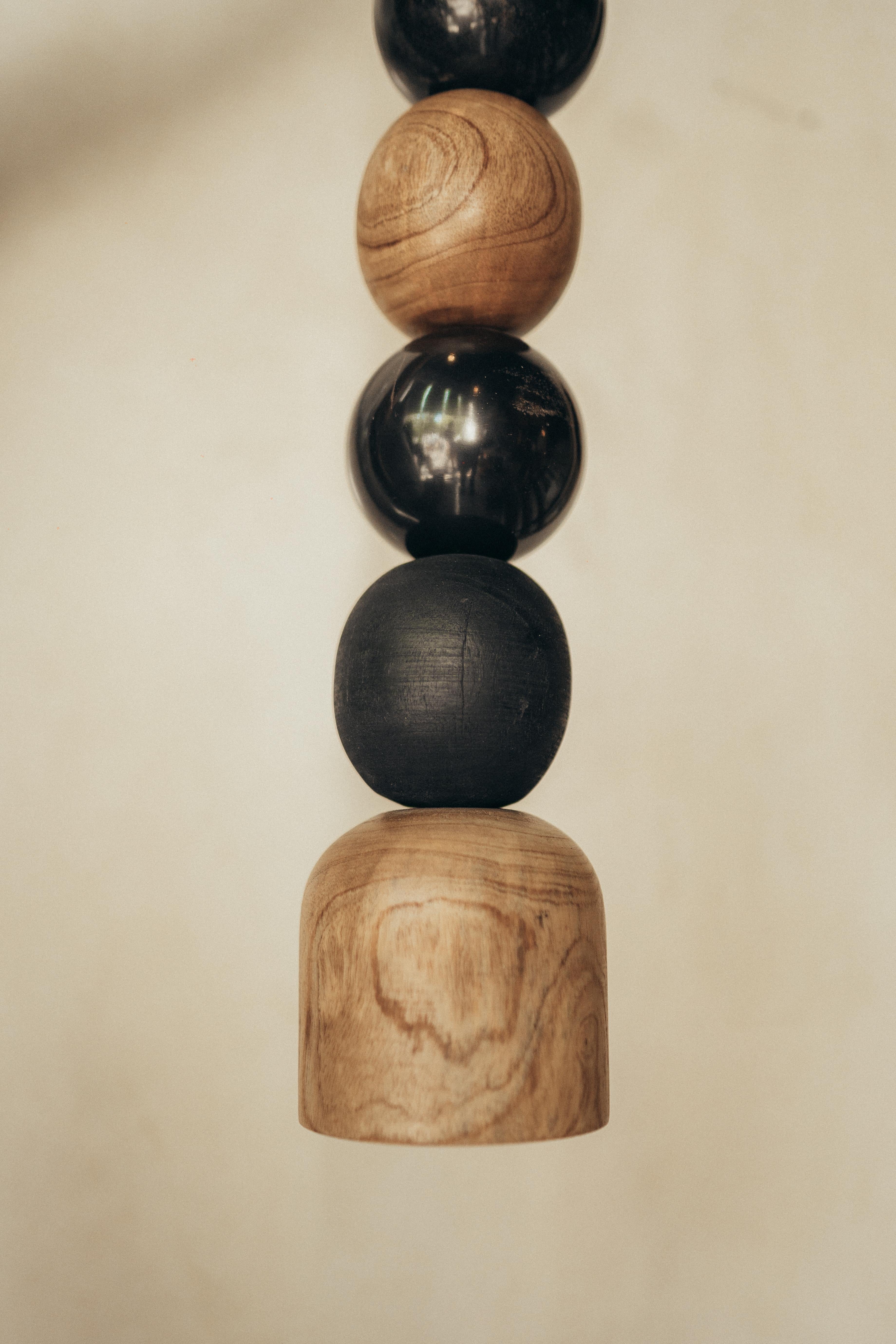 Post-Modern Pendant Lamp of Wooden, Burned, Natural and Black Marble Balls by Daniel Orozco For Sale