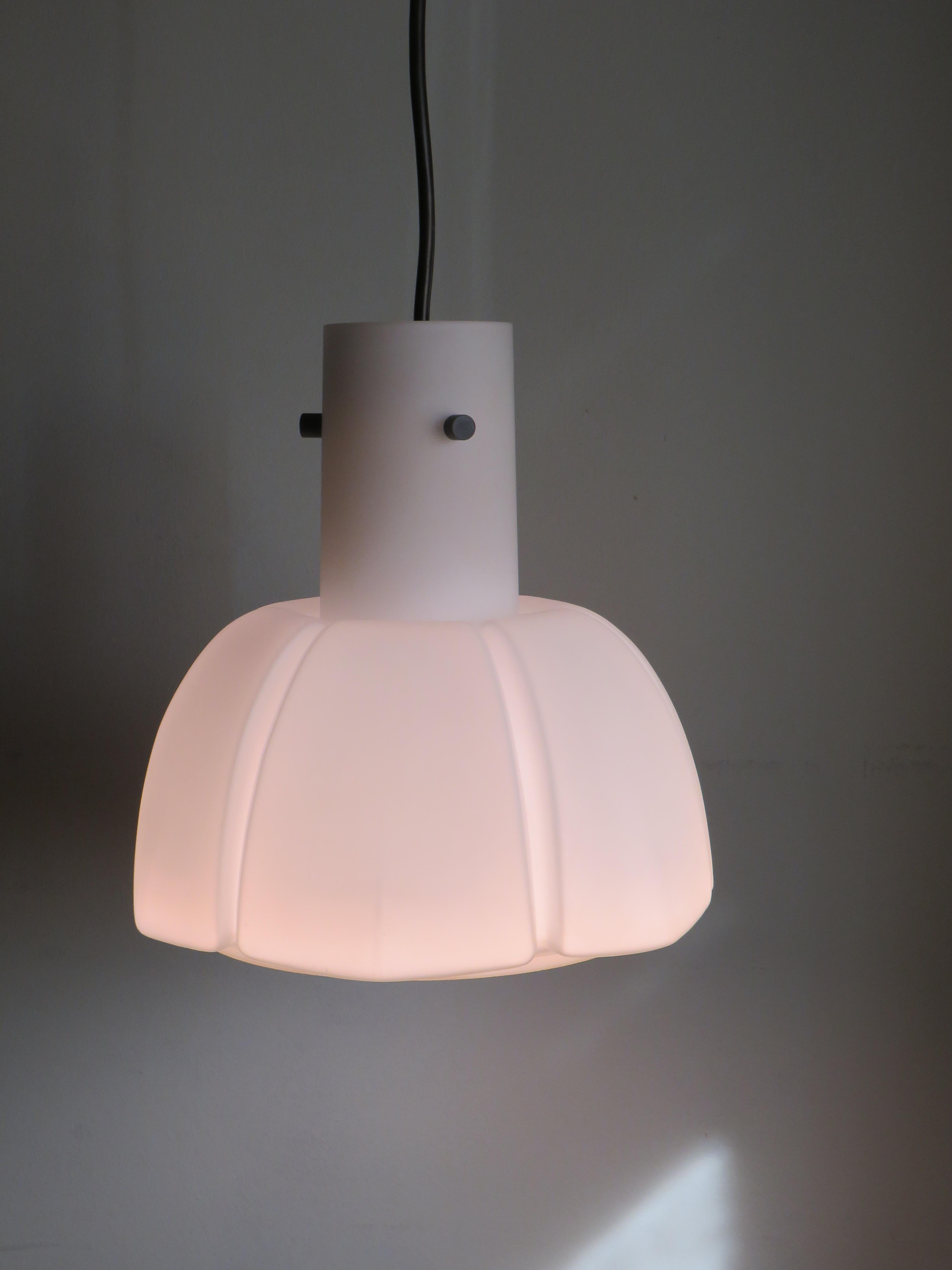 The lamp has a calyx shape made of thick white Opaline glass and a metal socket with an E 27 fitting, which is fixed in the lamp by means of 3 metal elements.
The lamp is in perfect condition and the factory label is present.
The height of the