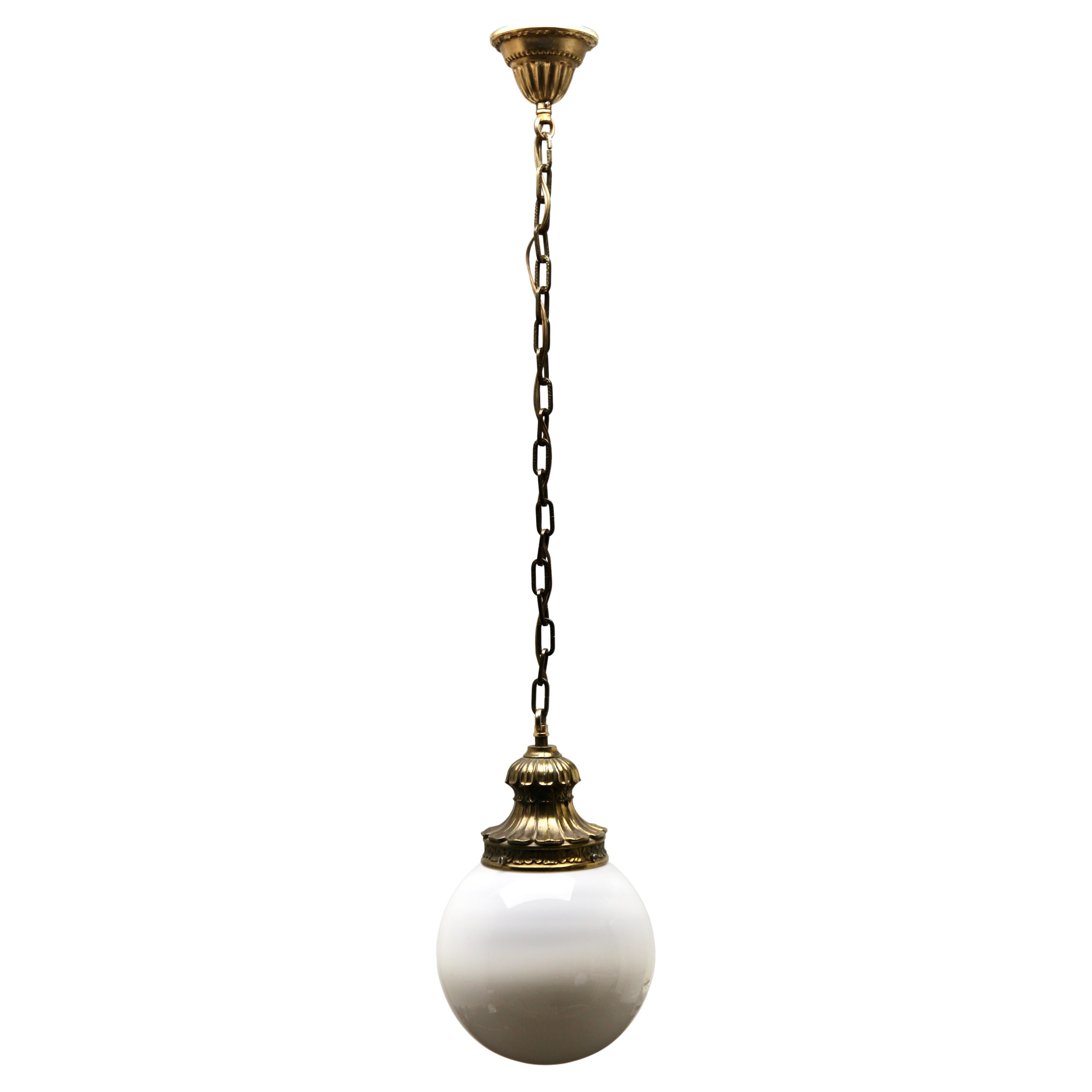 From the range by the Phillips Company, this centre-light is on a central chain. The lamp has a fitting on a Solid Brass plate and holds 
a globular shade of opaline glass.

In good condition and in full working order with standard lamp fittings