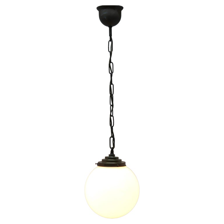 From the range by the Phillips Company, this centre-light is on a central chain. The lamp has a fitting on a Solid Brass plate and holds 
a globular shade of opaline glass.

In good condition and in full working order with standard lamp fittings