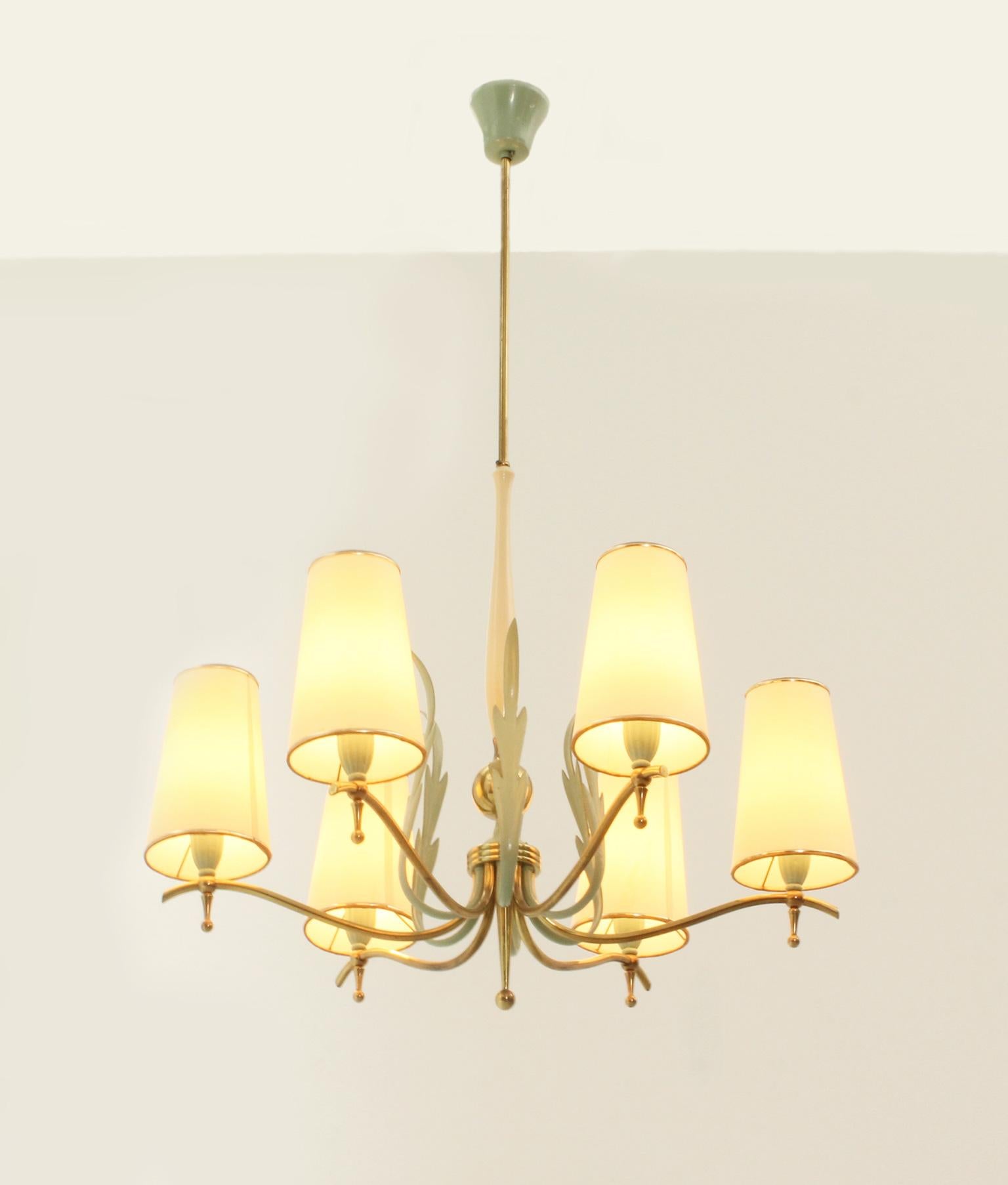 Pendant lamp with six arms produced by Stilnovo, Italy, 1940's. Documented. Brass and lacquered metal and wood. The shades have been renovated some years ago.