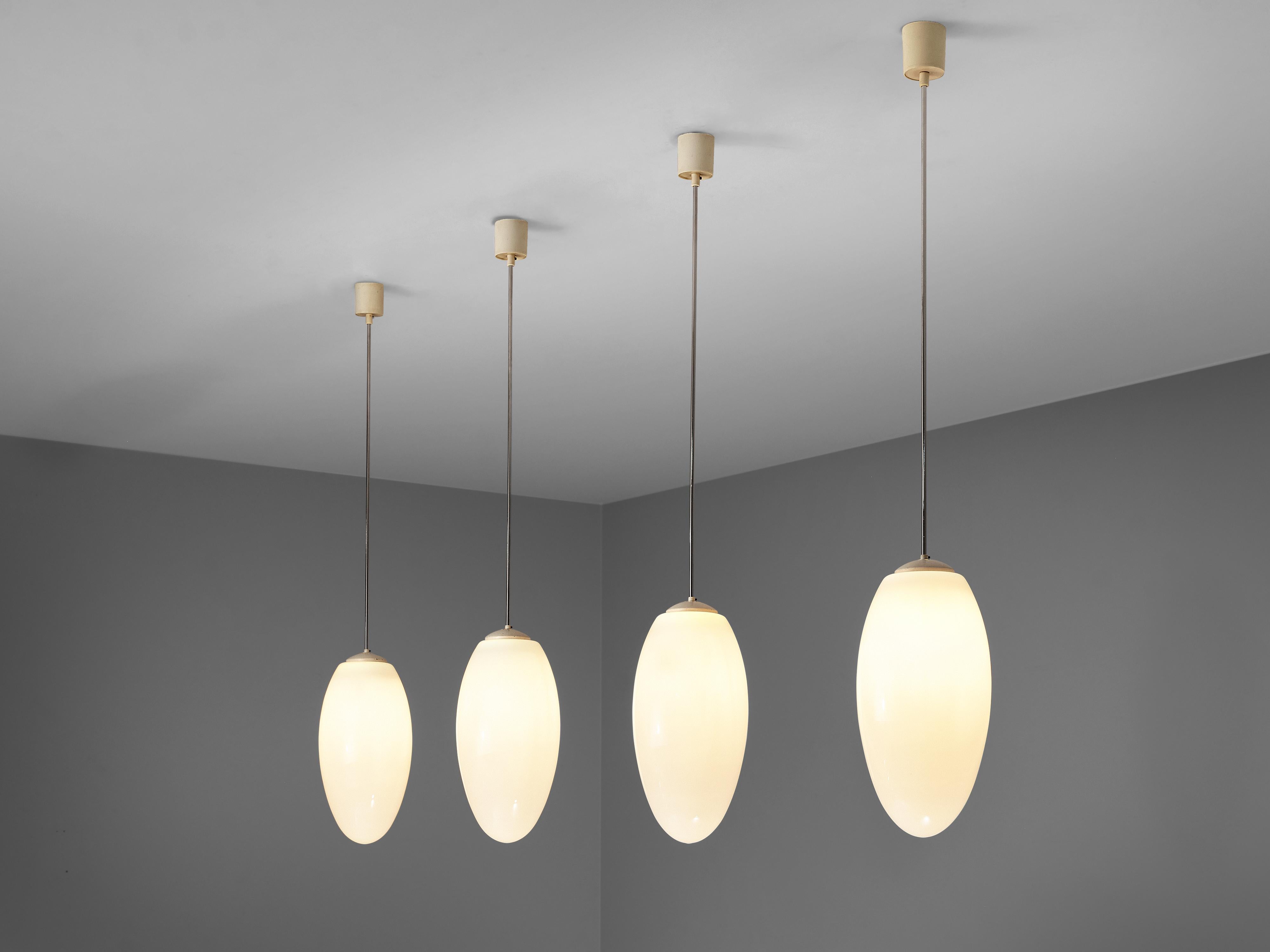 Pendant lamps, metal, opaline glass, plastic, Europe, 1970s

Minimalist pendant lamps with drop-shaped glass shade. The lamps hang on metal stems that end in a cylindric ceiling fixture. The well-balanced, elegant shape of the lamp surrounds the