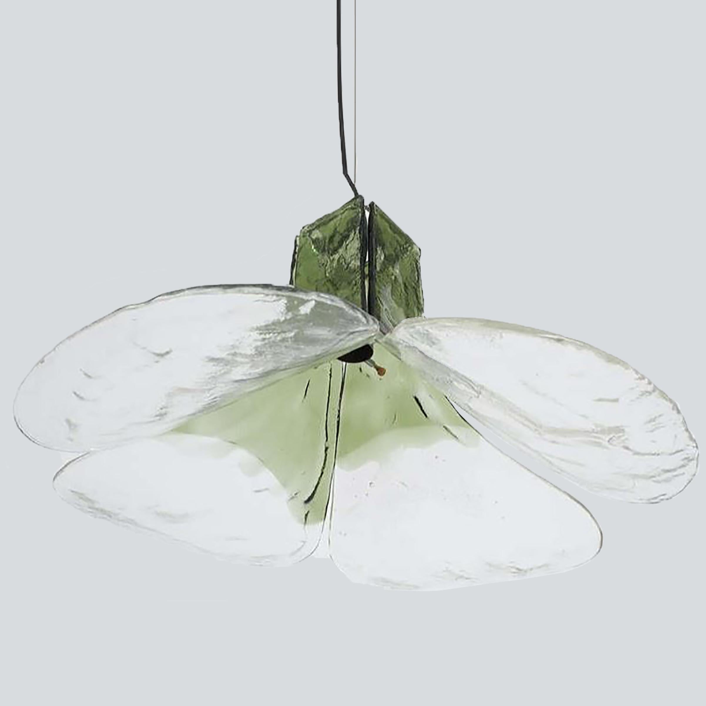 Pendant lamps model LS185 by Carlo Nason for Mazzega.
Four crystal clear and green leaves compose this beautiful piece made in thick handmade Murano glass.

Measures: H 16.93” (43 cm), D 23.62
