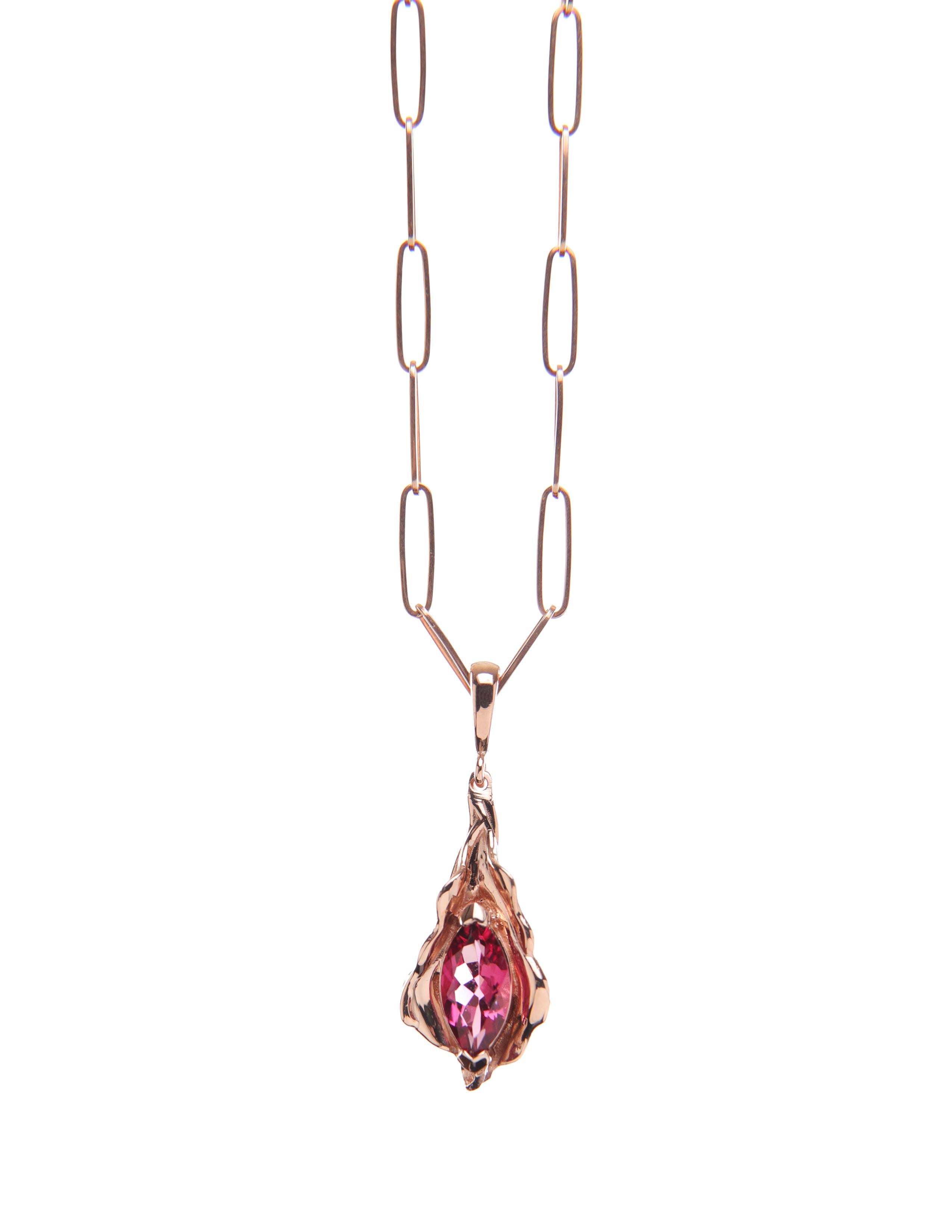 Rose gold and rose tourmaline leaf charm flutters naturally. 

