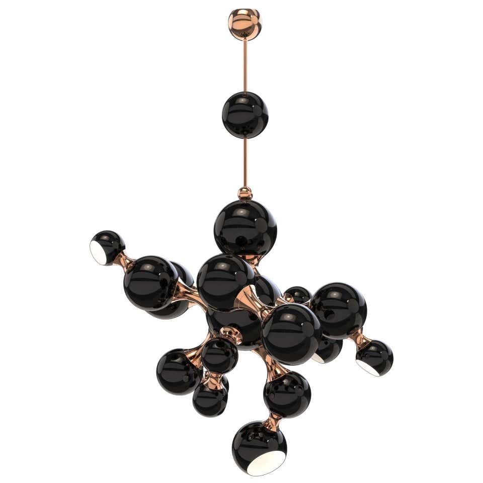 This light pendant is a modern design interpretation of the atomic age, inspired by the composition of the atom. Building this unique lighting design using materials such as brass, steel and aluminum, Delightful skilled artisans arranged it in an