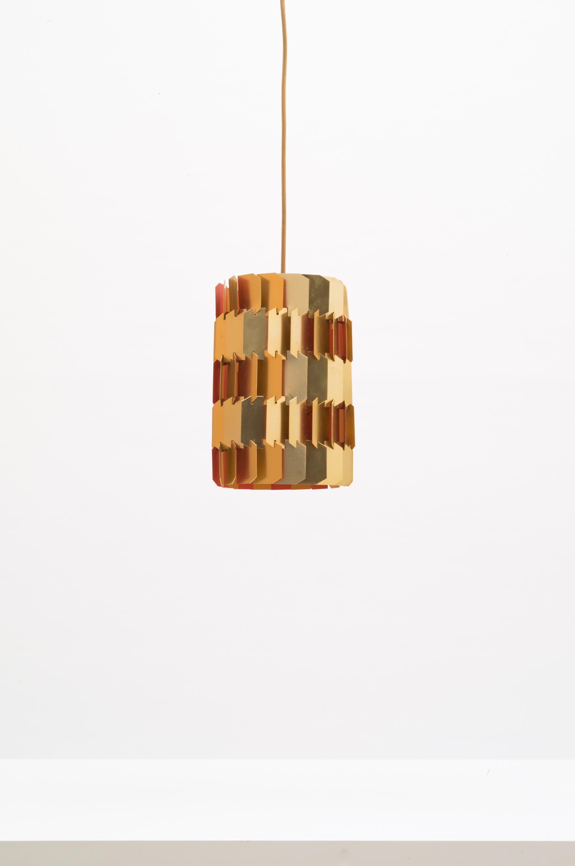 Pendant light designed by Louis Weisdorf for LYFA, Denmark 1960s. Made out of brass plated aluminium slates, two shades of orange on the inside for a warm cozy light. Comes with new gold colored textile cable.