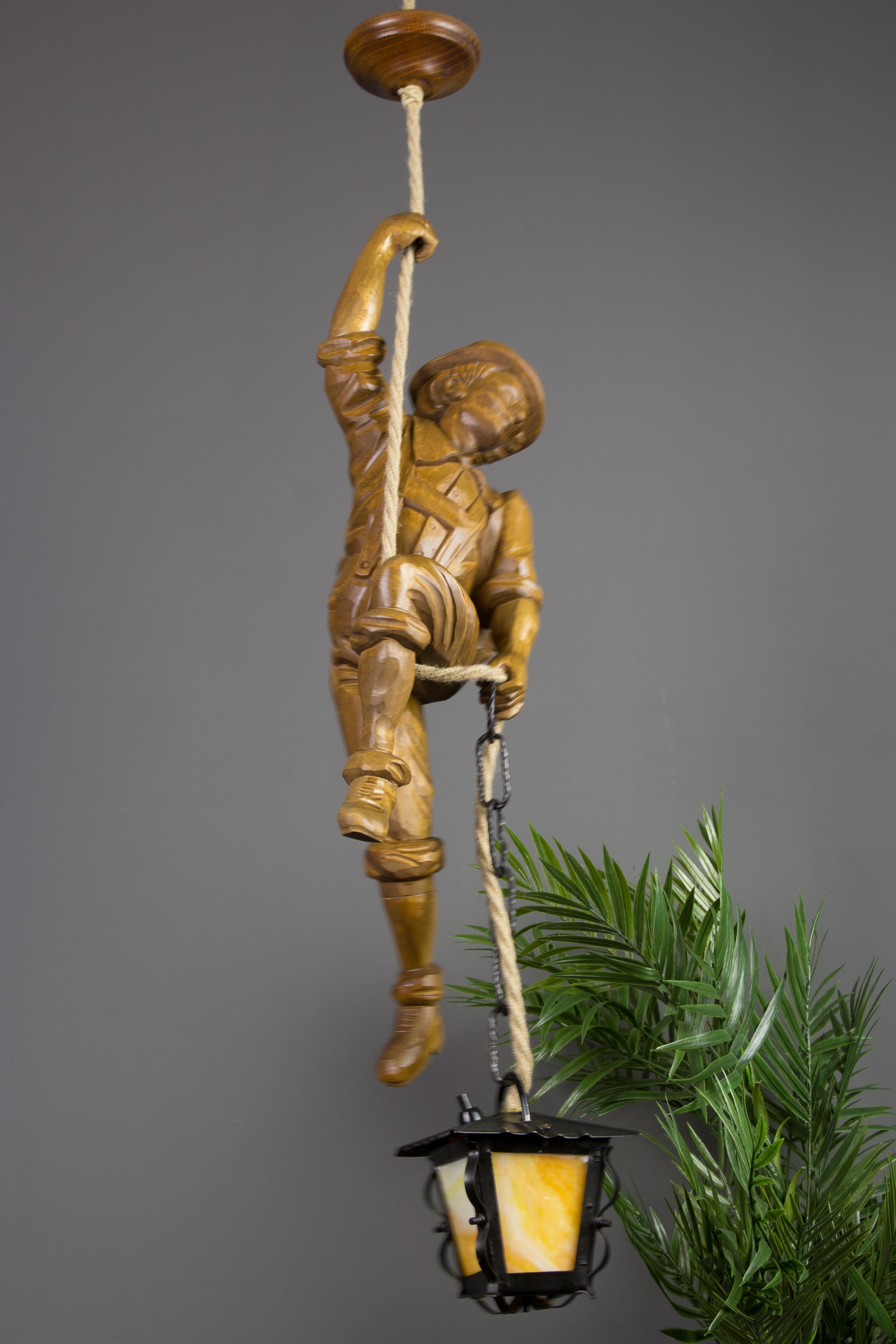 Black Forest Pendant Light Hand Carved Wood Figure Mountaineer Climber with Lantern, Germany For Sale