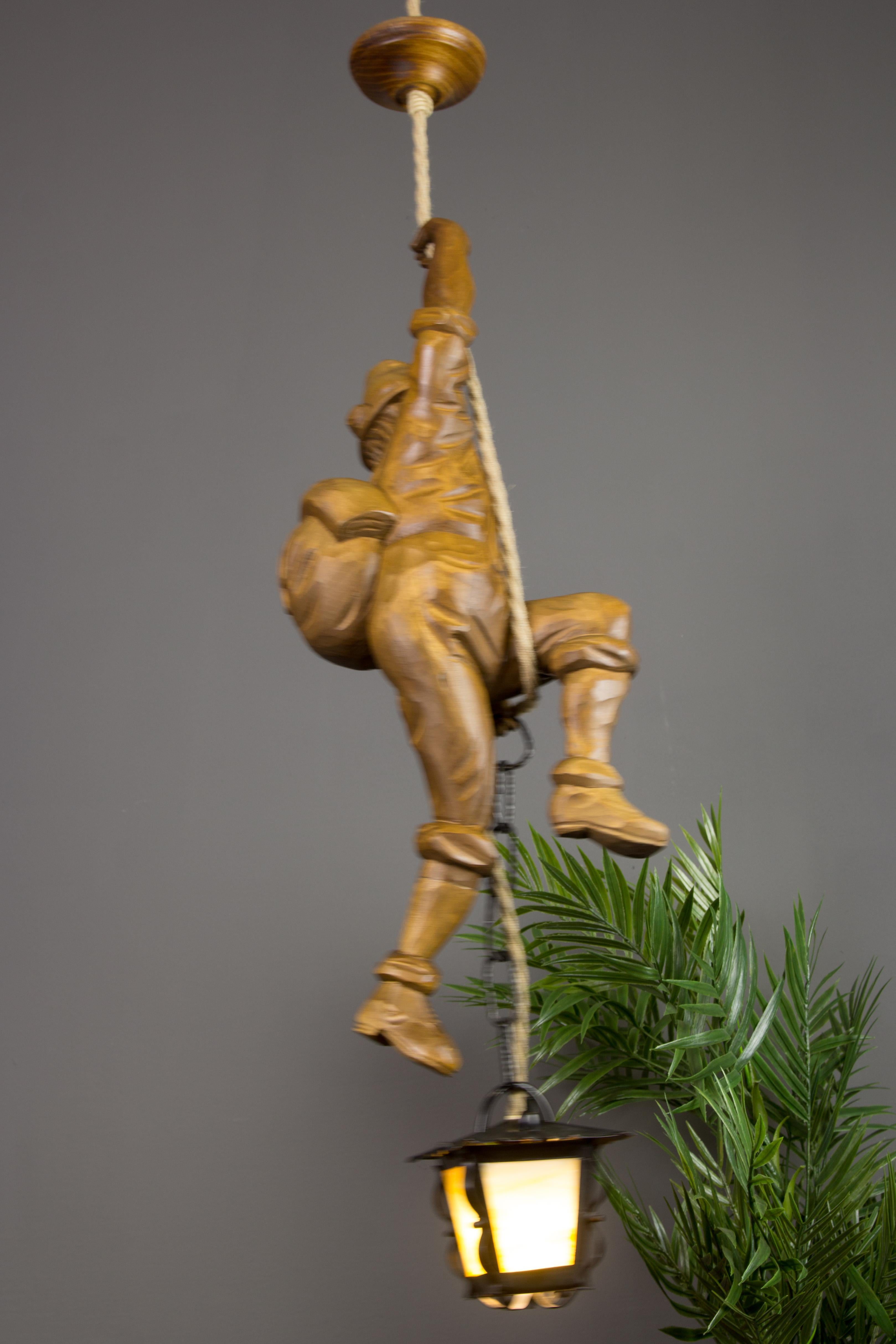 Mid-20th Century Pendant Light Hand Carved Wood Figure Mountaineer Climber with Lantern, Germany For Sale
