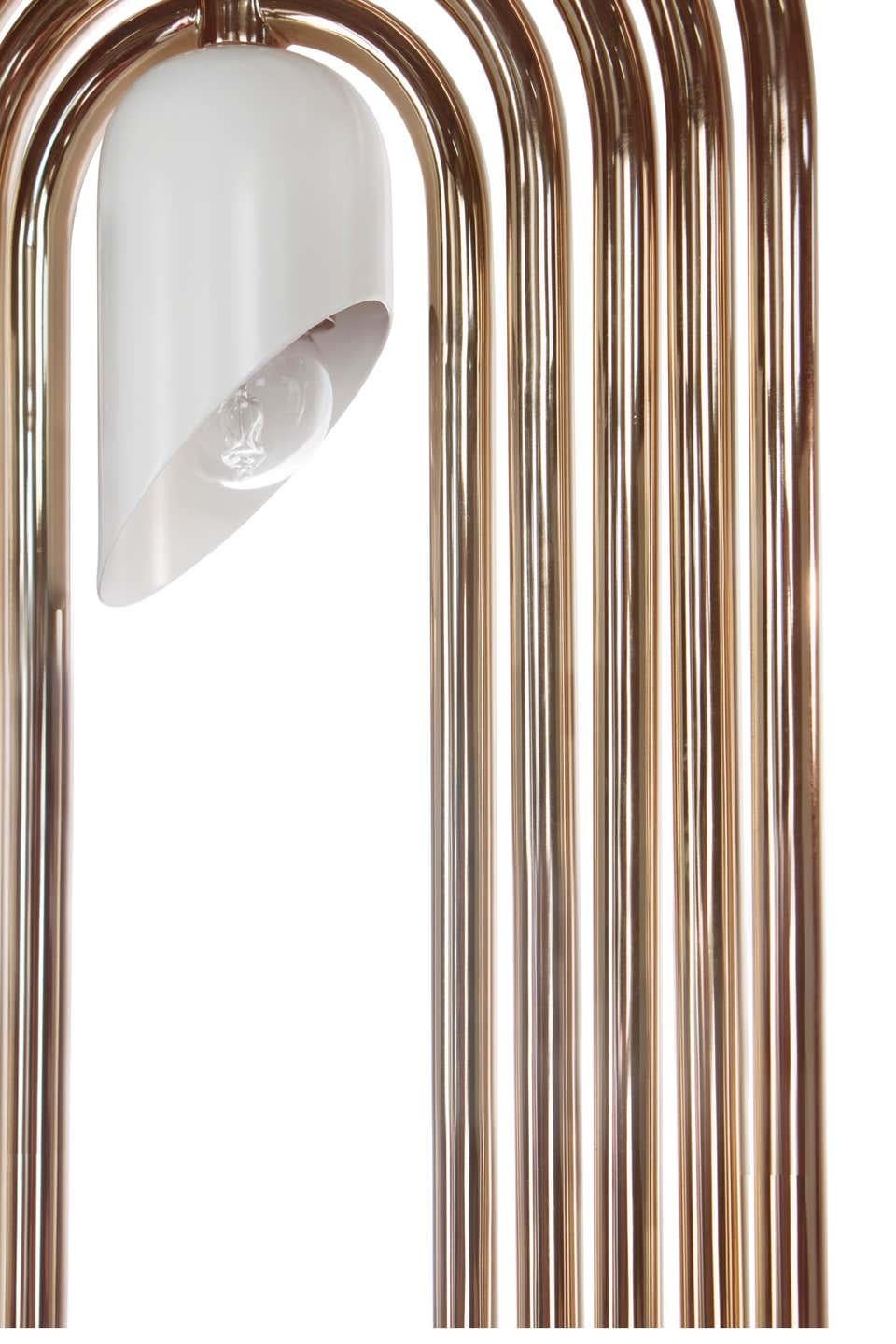 Pendant lamp is an Art Deco lighting fixtures handmade in brass and aluminum that boasts all the most special elements of this design movement. The body has five gold-plated finished movable arcs, which can all be rotated into the desired position,