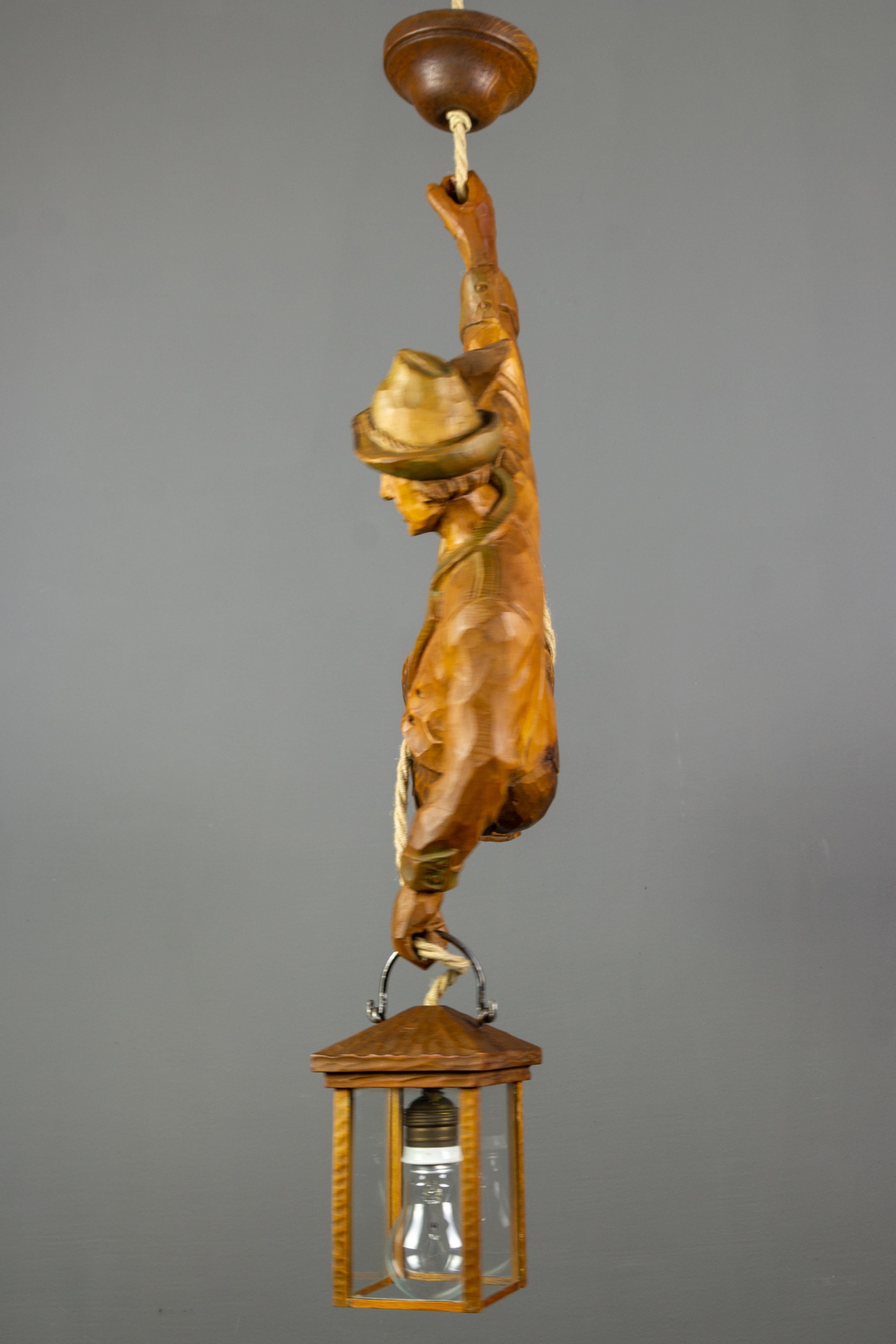 Metal Pendant Light with a Large Wooden Figure Mountain Climber with Lantern, Germany For Sale