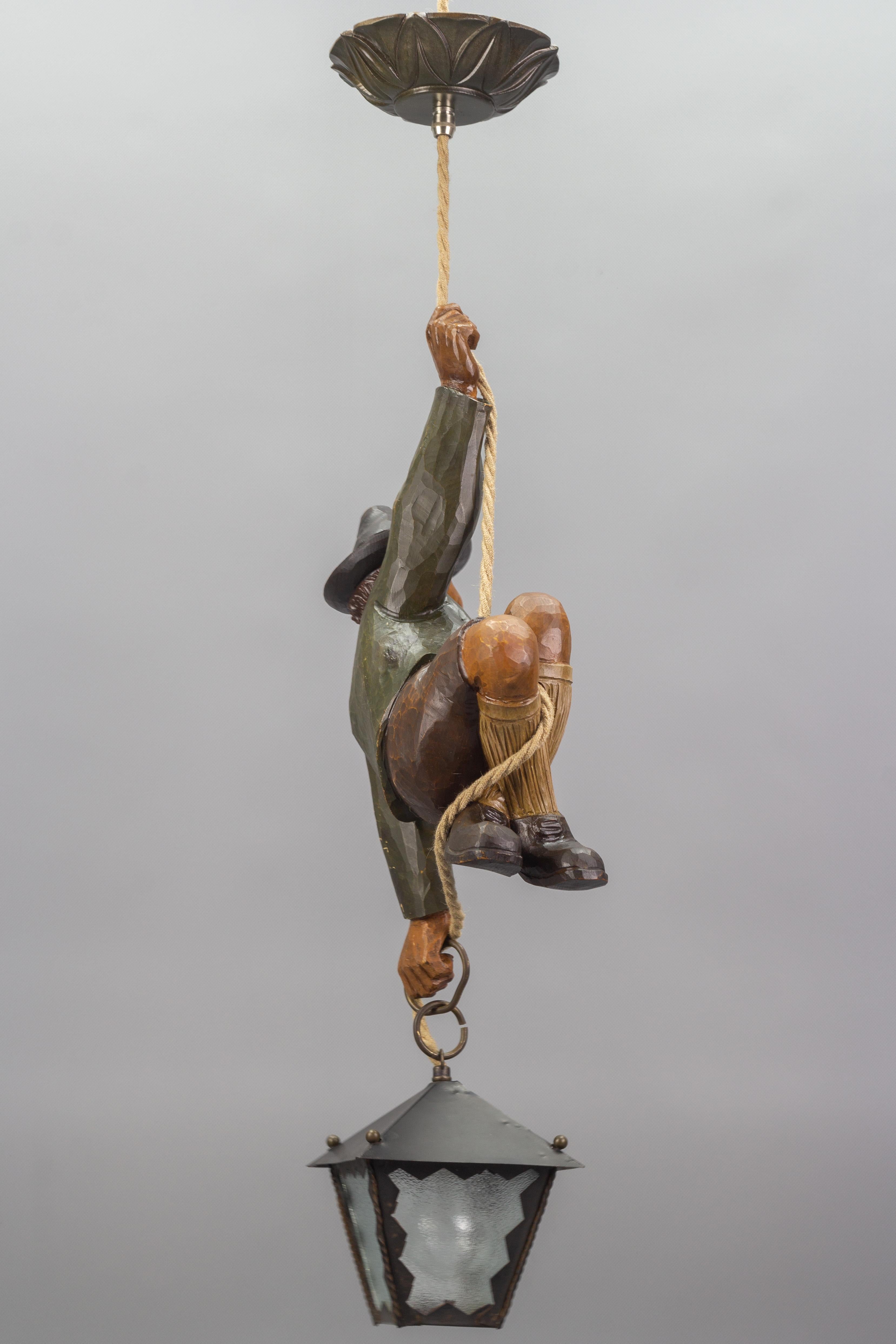 Mid-20th Century Pendant Light with Hand Carved Sculpture of Mountain Climber and a Lantern For Sale