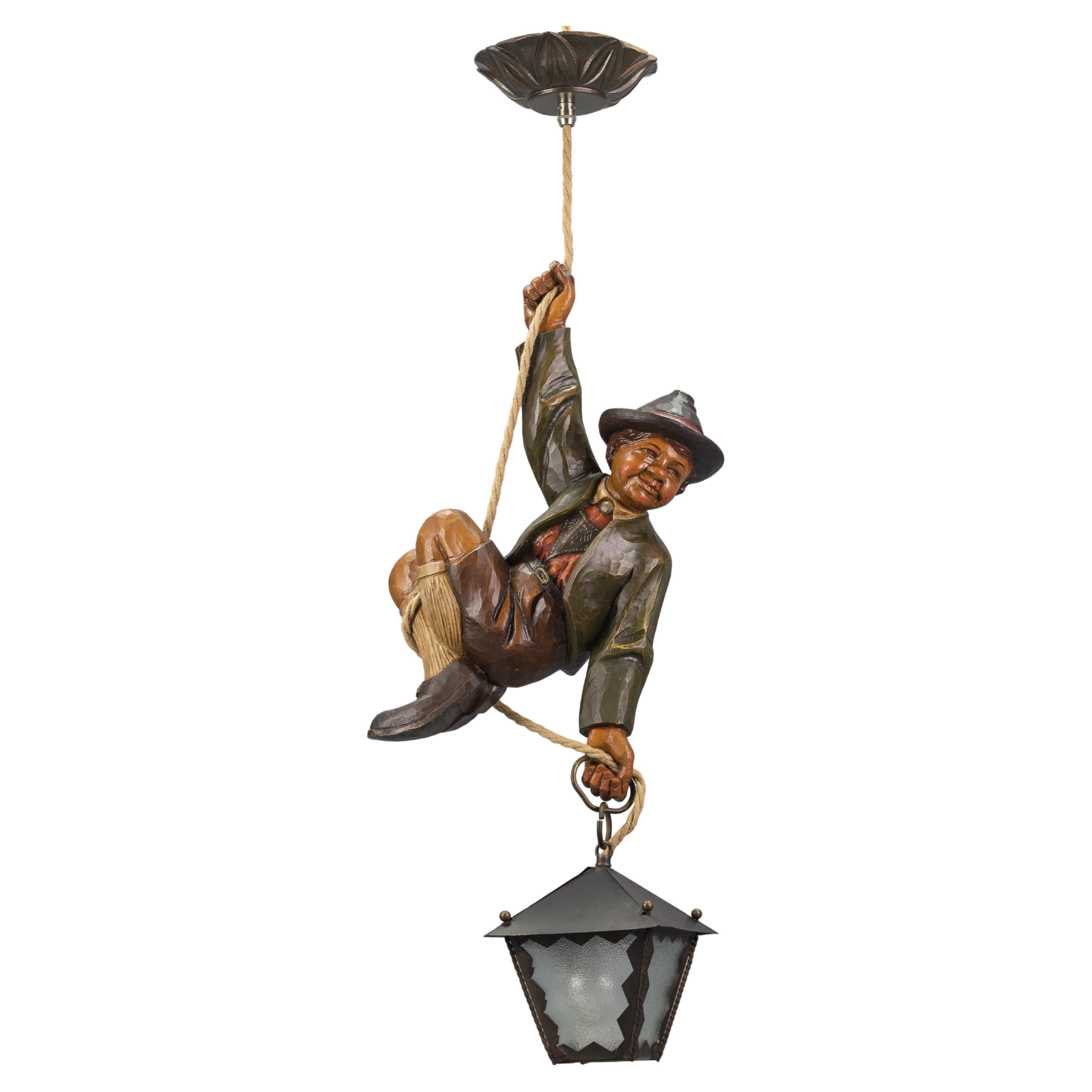 Pendant Light with Hand Carved Sculpture of Mountain Climber and a Lantern