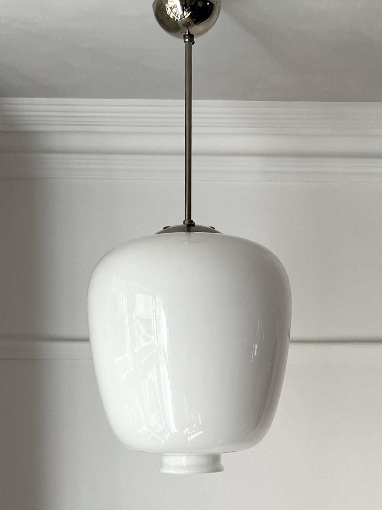 Scandinavian Modern Pendant Light with Large White Glass Shade attributed to Pukeberg, Sweden For Sale