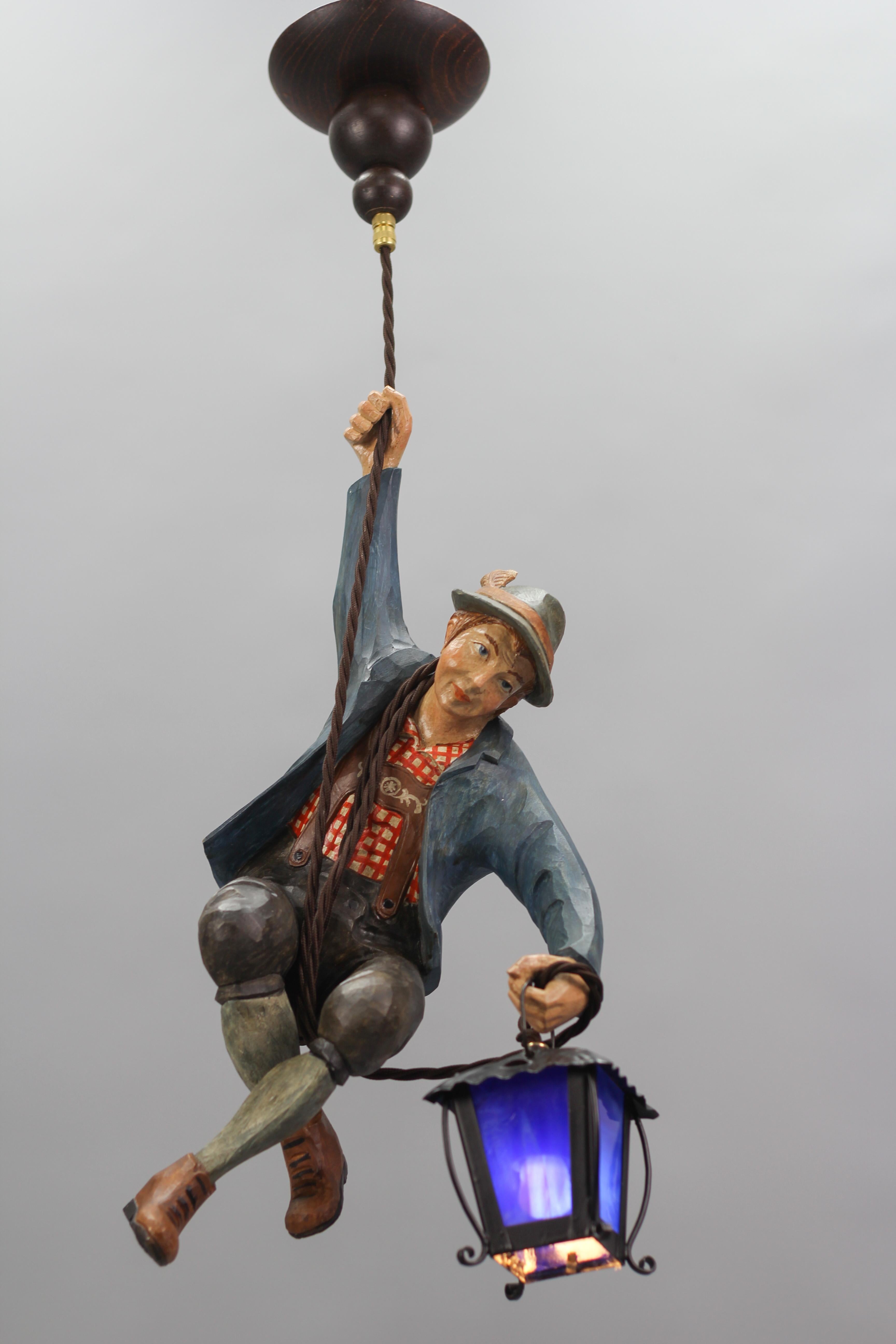 Pendant Light with Figure of a Mountain Climber and a Blue Glass Lantern For Sale 11