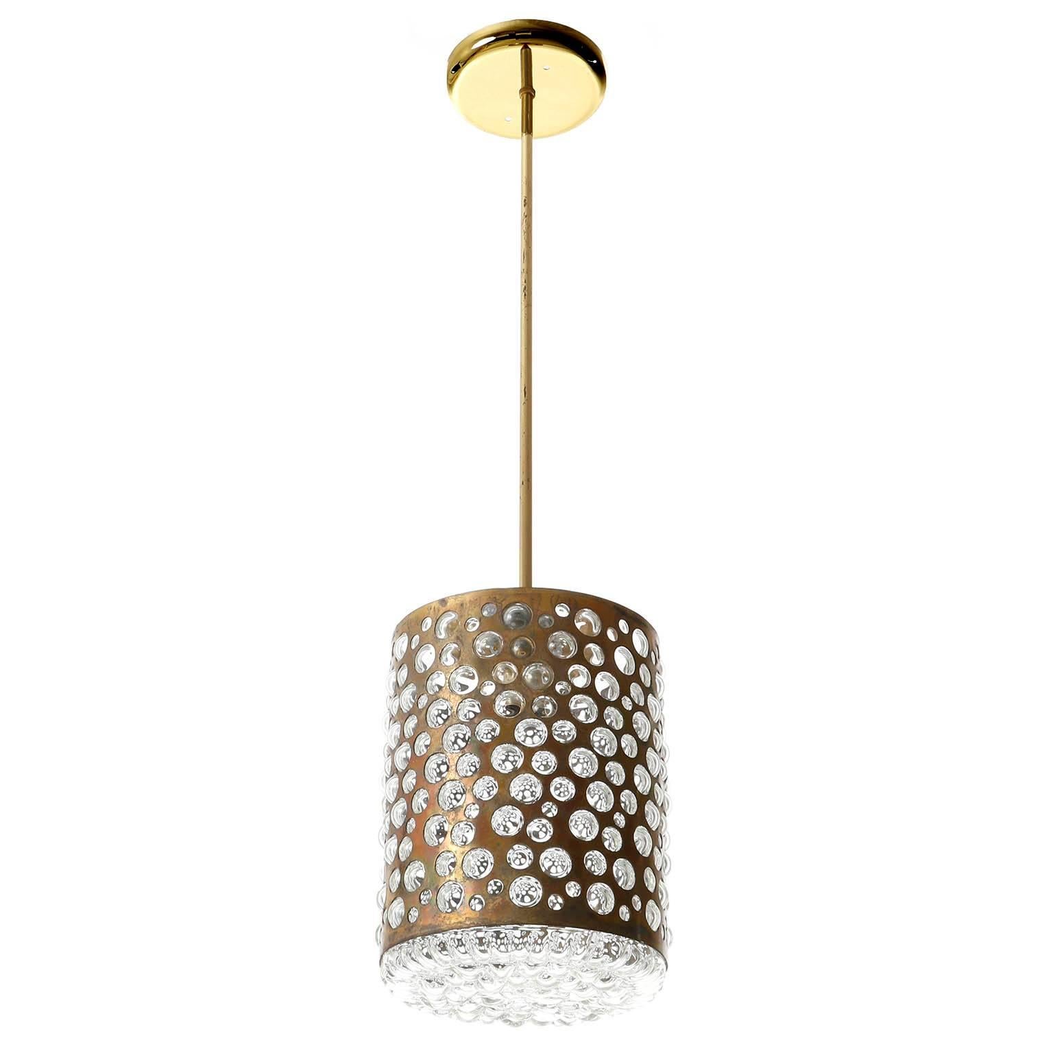 One of three very rare and exceptional pendants by Rupert Nikoll, Vienna, manufactured in midcentury, circa 1960 (late 1950s or early 1960s).
The textured glass is similar to the lights of Kalmar or Limburg from that time period.
The light fixtures