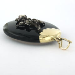pendant / medallion of onyx and silver flower with rose cut diamond 14k gold